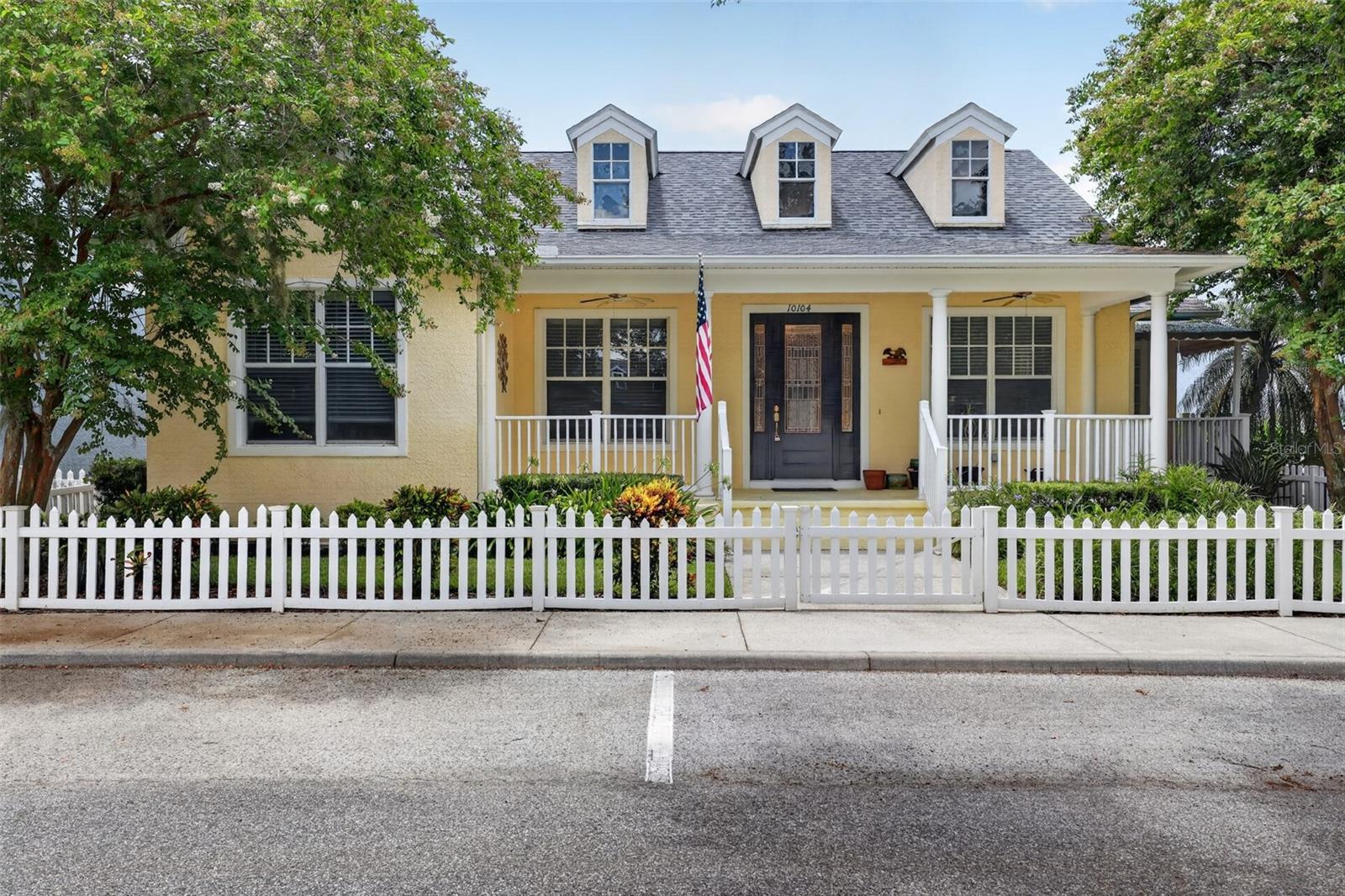 Welcome to this beautifully maintained 3-bedroom, 2-bathroom home with a 2-car garage, built in 2004 and filled with timeless charm and thoughtful upgrades. From the inviting front porch overlooking the Village Green to the classic picket fence, this home offers exceptional curb appeal and a warm, welcoming feel.

Inside, you’ll find wood flooring, ceramic tile, tray ceilings, plant shelves, surround sound, upgraded lighting, plumbing fixtures, and hardware throughout. The spacious family room features a cozy gas-burning fireplace, while the oversized secondary bedrooms provide plenty of room for family, guests, or a home office.

The kitchen is designed for both everyday living and entertaining, showcasing 42-inch cabinetry, granite countertops, a center island, and a full suite of stainless steel KitchenAid appliances, including a refrigerator, double wall ovens, microwave, and gas cooktop. Just off the kitchen, the breakfast porch offers the perfect spot to enjoy your morning coffee.

Step outside to a private backyard retreat featuring a large brick patio with a fountain and built-in speakers, creating an ideal setting for relaxing or entertaining.

Located in the highly desirable Longleaf community, residents enjoy an exceptional lifestyle with Village Greens, parks, hiking and biking trails, basketball, tennis and volleyball courts, a baseball field, Town Hall, and a full calendar of community events throughout the year. An elementary school and preschool are conveniently located within the neighborhood, adding to the community’s appeal.