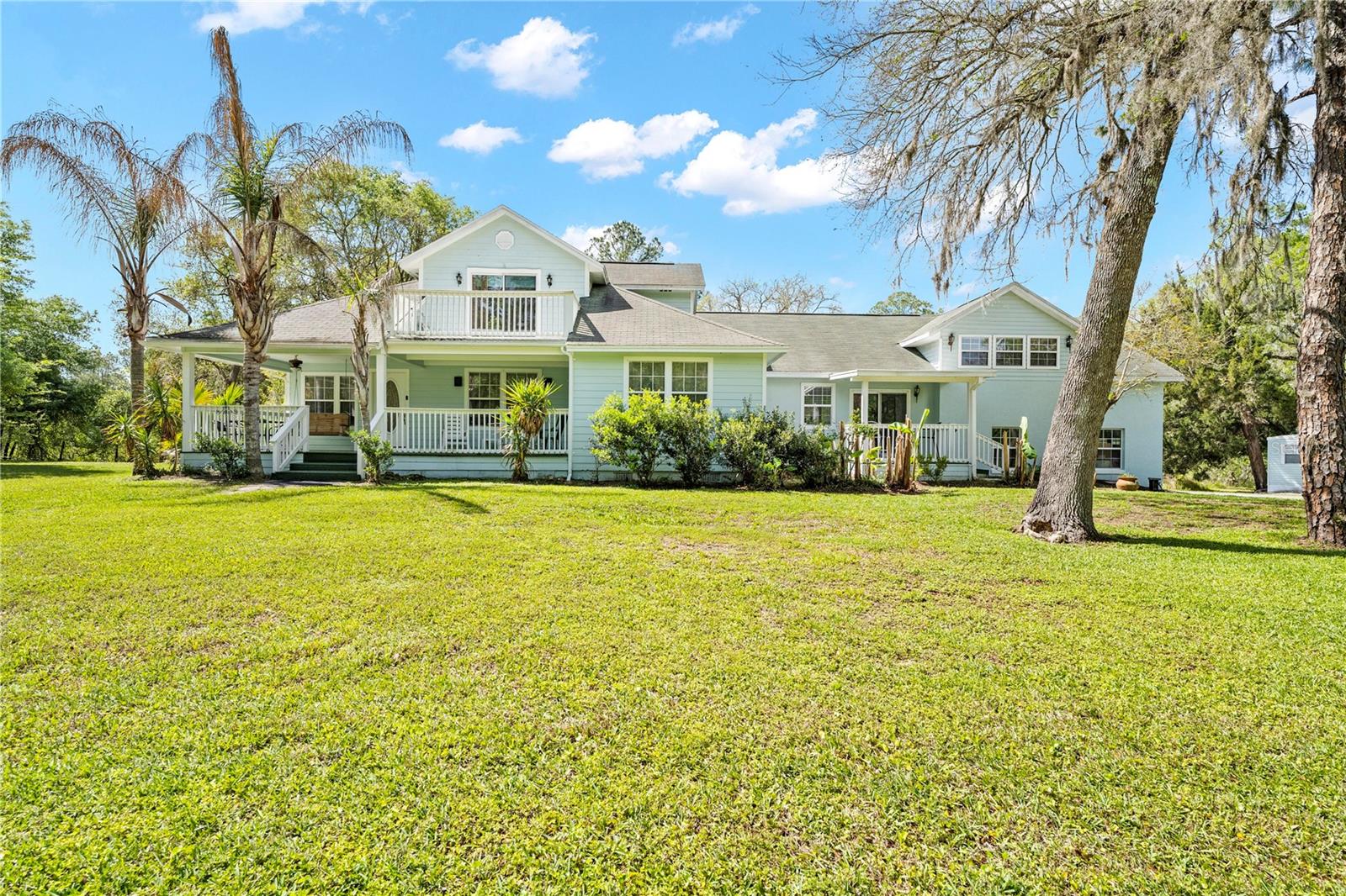 Privacy meets convenience in this beautiful home located in Ridge Manor Estates. Do not let the address fool you. You are just minutes from I-75 and Highway 301, making it easy to get where you need to go while still enjoying a quiet, private setting.

Welcome to peaceful country living with all the modern features you love. This stunning two story home sits on over 3 gorgeous acres and offers plenty of space for families, guests, and entertaining. With 4 bedrooms and 4 full bathrooms, and 3 of them being private suites, this home is perfect for multi generational living or hosting visitors in comfort.

The large family room can be anything you want it to be. Picture movie nights, game days, a pool table, or even karaoke with friends. As you walk in, you will notice the bright, open feel of the home. The formal living and dining areas flow right off the kitchen, making it easy to host holidays and special gatherings.

The spacious kitchen is the heart of the home, featuring a large breakfast bar that keeps everyone connected. The split floor plan gives everyone their own space, and there is even a separate living area with a private entrance, perfect for guests or extended family.

Step outside and enjoy the best of Florida living. Relax on the front porch or unwind on the back porch overlooking your backyard oasis. This property is located on a freshwater canal that leads directly to the Withlacoochee River, giving you a peaceful water view and added outdoor enjoyment. You will love the firepit area, the newly built dock, and the beautifully maintained 3.4 acres.

This home has never flooded and offers both safety and peace of mind. The property is fully fenced with an electric gate, security system, and cameras already in place. A paved driveway adds to the clean and polished feel from the moment you arrive.

This home is incredibly clean, truly one of the cleanest homes you will see. It has been very well maintained and is completely move in ready.

The home also features an oversized garage and a detached workshop, giving you plenty of room for storage, hobbies, or projects.

If you have been looking for space, privacy, and a place that truly feels like home, this is one you do not want to miss.
