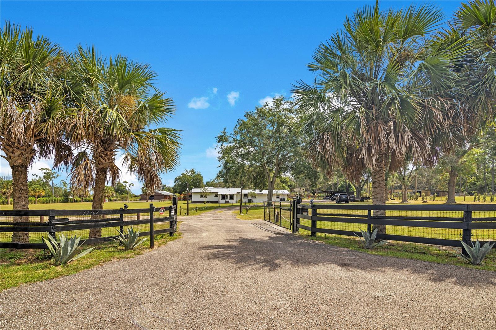 Stunning 4-Bedroom Estate on 4.81 Acres – A Private Outdoor Oasis!

Welcome to this beautifully updated 4-bedroom, 4-bathroom home nestled on nearly 5 fully fenced acres, No HOA, and complete with an electronic gate for privacy and security. Step inside to discover newly renovated bathrooms, a modern kitchen, and upgraded closets—thoughtfully designed for both comfort and style.

The outdoor space is truly one-of-a-kind, offering a resort-style experience perfect for entertaining. Enjoy a sparkling pool with a custom deck, multiple covered patios, pergolas, and a picturesque trellis walkway. The crown jewel of the backyard is a massive covered entertaining area featuring a bar, custom epoxy flooring, and built-in electrical for fans, lighting, and even a projector. There are also two half bathrooms attached to this impressive structure. 

Just steps away is a large, shaded playground with artificial turf—ideal for families. The property also includes a barn/stable that’s perfect for storage or housing pets. At the rear of the estate, motorsports enthusiasts will love the full-sized racetrack, ready for recreational use.

This is more than just a home—it’s a private retreat with every amenity you could want. Don’t miss the opportunity to own this unique and versatile property!