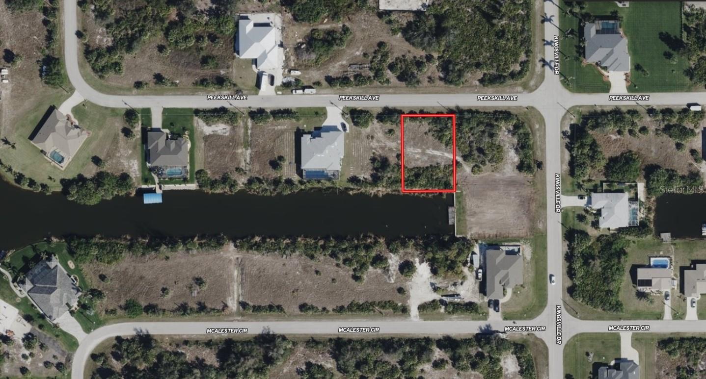 Your opportunity to own a sailboat acessible, Gulf-access waterfront lot in South Gulf Cove, Port Charlotte, Florida. Located at 14149 Peekskill Ave, this property offers boating access to Charlotte Harbor and the Gulf, some of the best fishing in the world! Making it ideal for boating enthusiasts and waterfront buyers. This waterfront lot in South Gulf Cove features public water and sewer availability, allowing for efficient new construction of a custom home. The property is situated in a highly desirable area surrounded by newer homes and ongoing development, supporting strong long-term value. South Gulf Cove is known for its extensive canal system, public boat ramps, and boating lifestyle, with convenient access to marinas, golf courses, shopping, dining, and Gulf Coast beaches. Nearby destinations include Boca Grande, Englewood Beach, Punta Gorda, and Charlotte Harbor, all easily accessible by land or water. Quick access to US-41 and I-75 provides convenient travel throughout Southwest Florida.