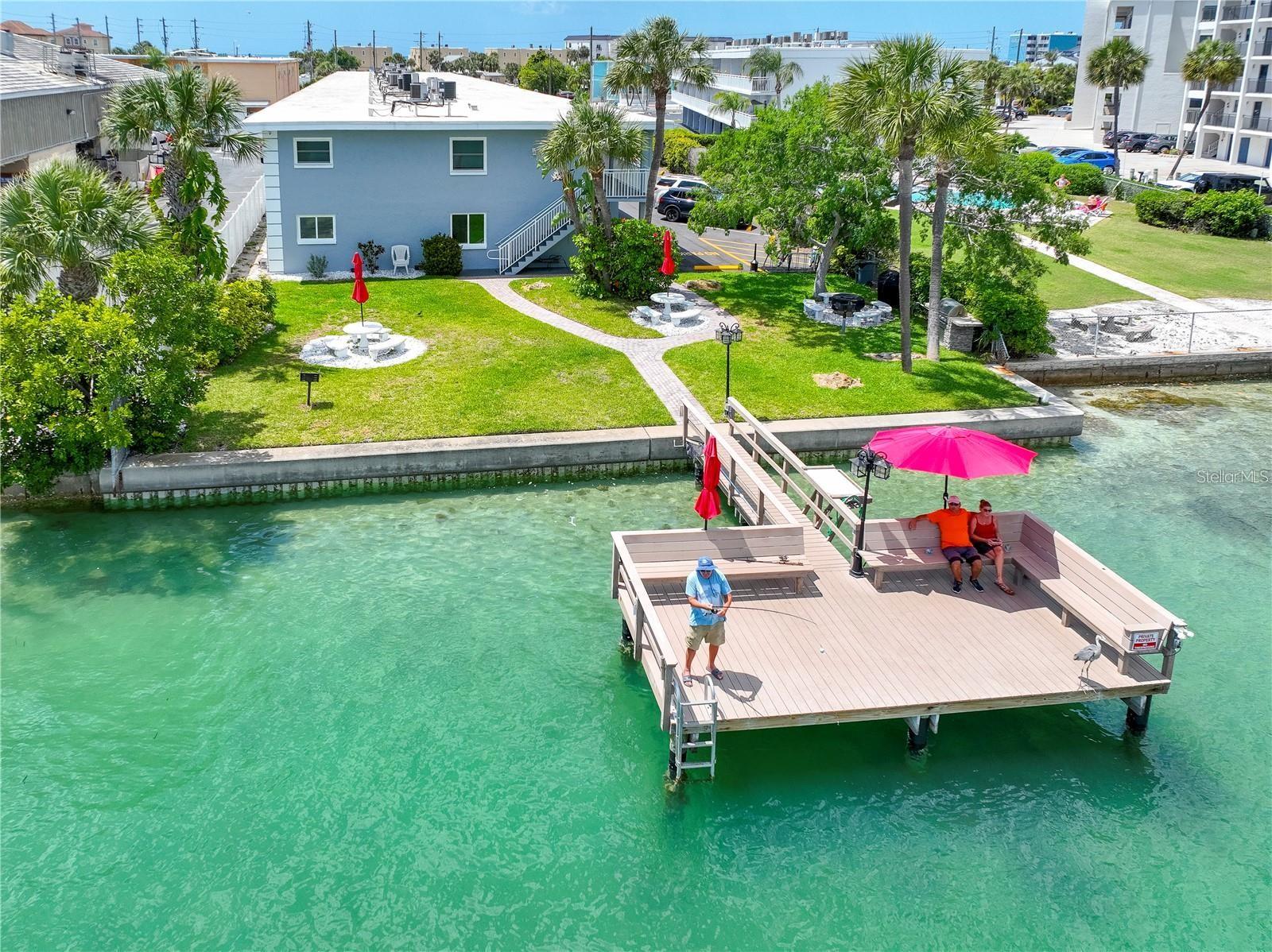 Live the carefree BEACH LIFESTYLE you've been dreaming of in this beautifully renovated second-floor condominium just steps from the sugar-white sands of world-famous Sunset Beach. Whether you're searching for a full-time residence, vacation getaway, or investment property with excellent rental potential, this move-in-ready one-bedroom condo is an exceptional opportunity.
Completely updated with stylish, modern finishes, the bright interior offers a welcoming coastal feel, added privacy, and even glimpses of the water from the second-floor location. A recent BANK APPRAISAL valued the property AT $230,000, offering added confidence in its value.
Spend your mornings on the beach, your afternoons in the Gulf, and your evenings enjoying spectacular Florida sunsets. Behind the building, the peaceful Intracoastal Waterway features a PRIVATE DOCK where you can fish, watch dolphins, or simply unwind as boats pass by.
The location is hard to beat. Walk to popular waterfront restaurants, beach bars, and cafés, with a convenience store directly across the street and a grocery store just over a mile away. The nearby Sunday Market adds even more charm with fresh produce, local vendors, and live entertainment.
This is your opportunity to own an updated coastal retreat in one of the Gulf Coast's most desirable beach communities.