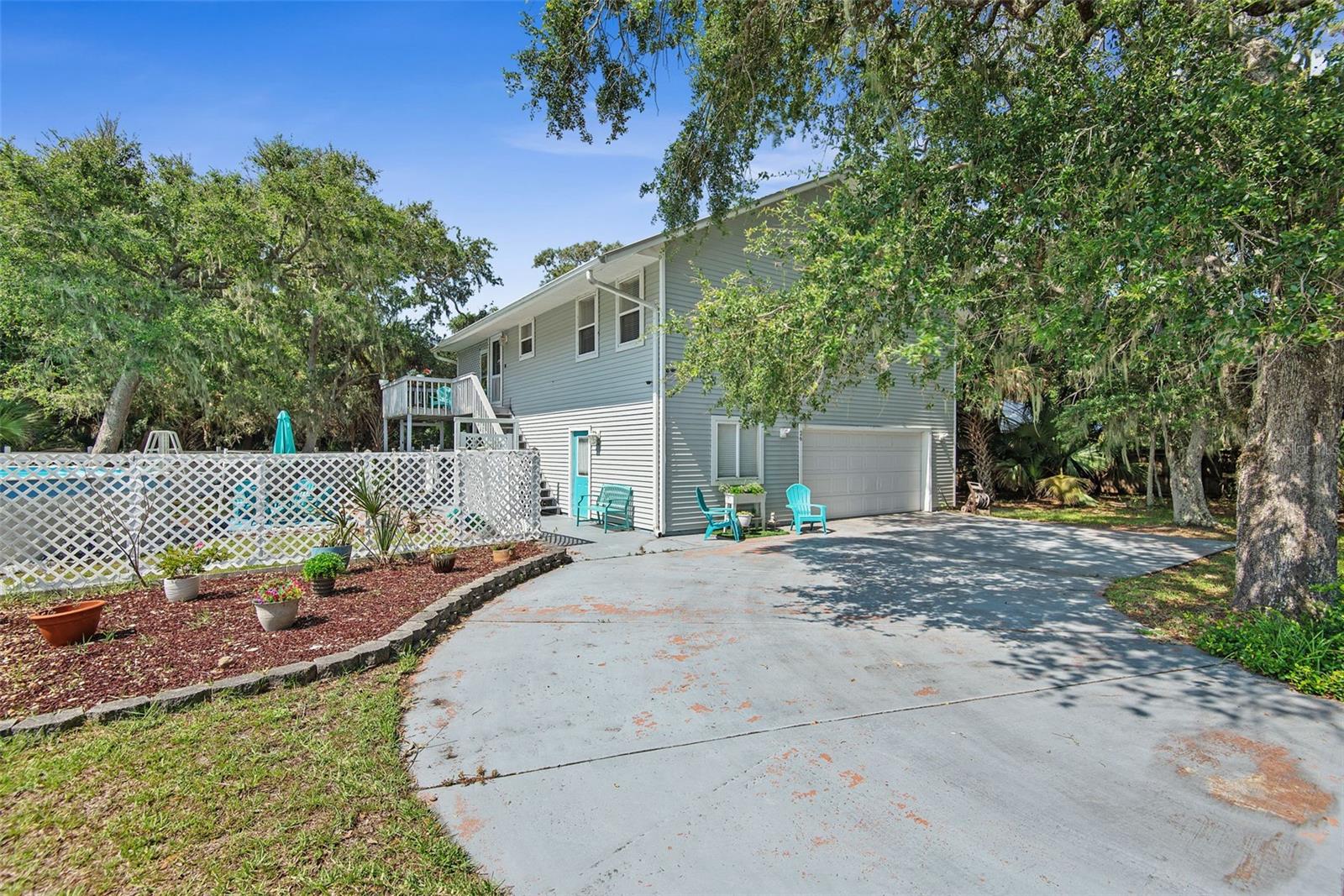Experience the best of Florida's coastal lifestyle in this exceptional home located in the desirable Maritime Estates community near Marineland. Perfectly positioned just minutes from the St. Johns County line, you'll enjoy convenient access to Flagler Beach, Palm Coast, and historic St. Augustine.
This property offers the rare advantage of deeded beach access, complete with a private dune walkover leading to the pristine sandy shoreline. You'll also have deeded access to the Intracoastal Waterway, where a covered community dock provides the perfect spot for fishing, boating, or simply relaxing while watching boats cruise by. Enjoy spectacular sunrises over the Atlantic and unforgettable sunsets along the Intracoastal—all just a short walk from your front door.
Designed with flexibility in mind, this two-story home features three bedrooms, including two spacious primary suites—one on each level. The upstairs primary suite includes a walk-in closet and an en-suite bath with a large tub/shower combination, while the guest bath features a walk-in shower. A spiral staircase connects both floors, and there's potential to install an elevator if desired.
The first-floor suite offers outstanding versatility as a private guest retreat or in-law suite, complete with its own living area, full bath, bedroom, direct garage access, and sliding glass doors opening to a peaceful rear porch overlooking a backyard filled with mature oak trees.
Upstairs, you'll find an open-concept living space highlighted by beautiful hardwood flooring, abundant natural light, and wood French doors leading to a spacious screened lanai with tranquil views of the wooded backyard. The kitchen is ideal for entertaining with granite countertops, a center island, and plenty of workspace.
The fully fenced side yard is home to an 18' x 36' above-ground freshwater pool, creating the perfect setting for entertaining family and friends. If preferred, the seller is willing to remove the pool before closing, leaving ample space for a future in-ground pool.
Additional features include real hardwood floors, solid wood doors and trim, a security system, Ring doorbell, an oversized two-car garage with extra space for a workshop or hobby room, and numerous possibilities to make the home your own. The home is served by Palm Coast city water, while sewer service is provided by a private company. Major updates include a new water heater installed in 2024 and an HVAC system that's approximately five years old.
Whether you're looking for a primary residence, vacation getaway, or coastal retreat, this home offers an exceptional combination of location, comfort, and lifestyle. Schedule your private showing today and discover everything this one-of-a-kind property has to offer.