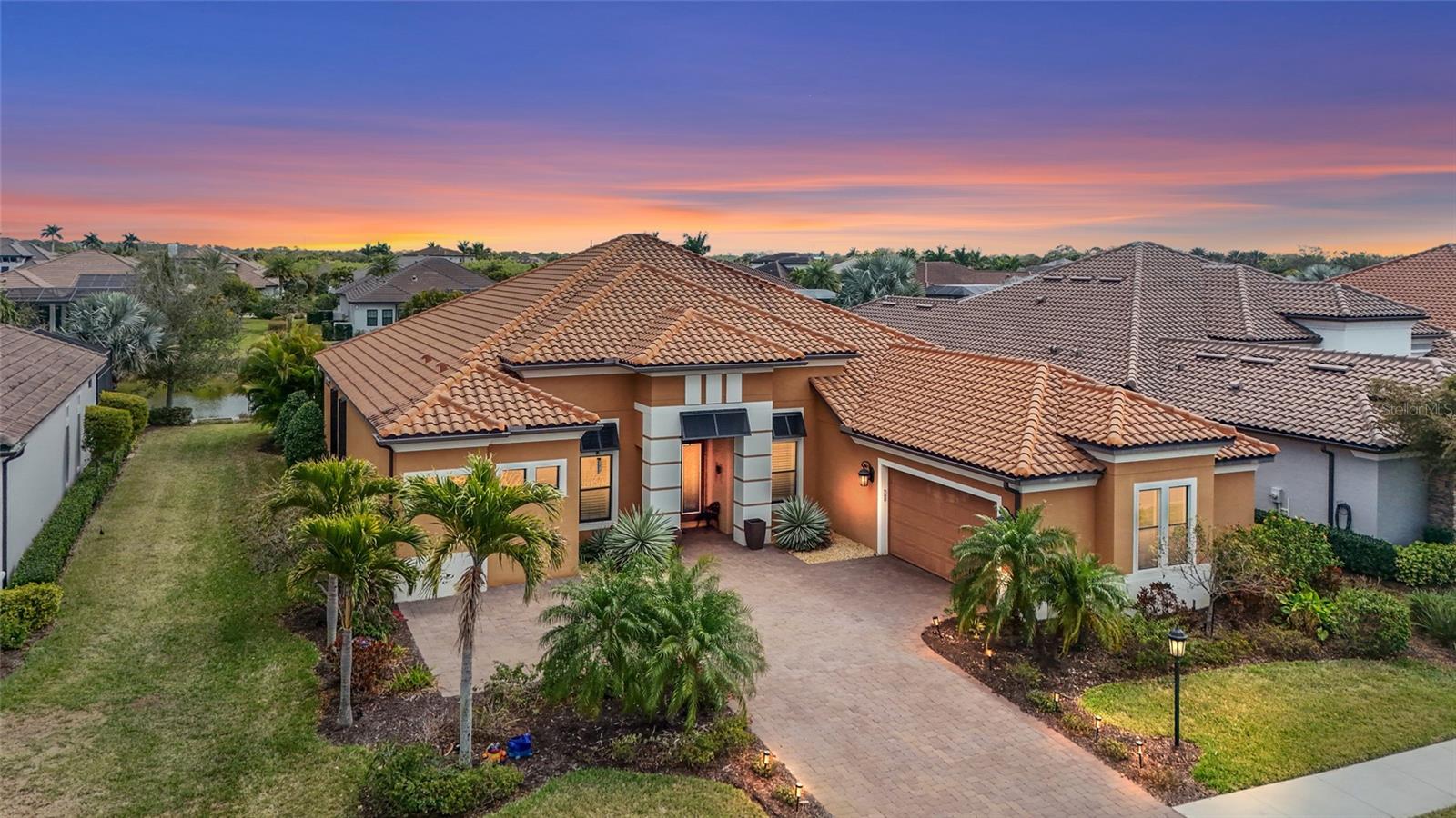 Rarely available Mercedes model pool home with a large bonus room in the much sought after community of Legacy Estates at Esplanade on Palmer Ranch. Boasting an amazing water view, this 3,639 sq.ft 3 bedroom, 3.5 bath, 2 car garage home offers a flexible floorplan with dining room, den, and a large bonus room that can be used as a media/ game room, second office or as an additional space for guests. Extensive home upgrades include heated pool, pocketing sliding doors from both the great room and bonus room and much more. The floorplan of this home is made for entertaining with the natural gas chef's kitchen opening to the aquarium windowed breakfast area. Pocketing glass sliding doors exit to the pool. The covered lanai has natural gas outdoor kitchen.This home includes energy saving solar panels, helping keep the electric bill under $100 per month. Esplanade on Palmer Ranch is the most highly sought-after gated community in South Sarasota. Known to cater to the active lifestyle, residents here enjoy an array of fabulous amenities, including a resort-style pool with cabanas and palm trees, eight pickle ball courts, two tennis courts, bocce ball, a children’s splash pad, three dog parks, walking trails, a lively Bahama Bar with a full-service restaurant and live music, plus a modern club house with a fully-equipped fitness center, games room, catering kitchen and wellness services. There’s also a full-time lifestyle manager who puts together a packed schedule of fun events and live entertainment. This community also puts you on the doorstep of the Legacy Trail and within a short drive from Siesta Key, America’s number one   beach as well as minutes from top-ranked Pine View School. Schedule your private showing today!