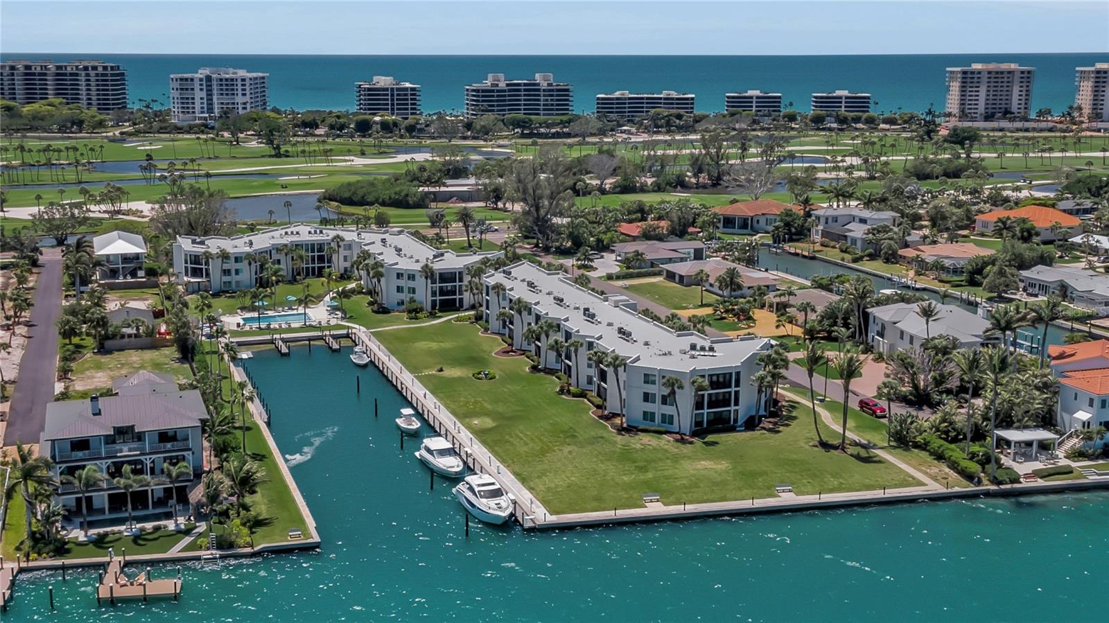 Set within an intimate 39-residence waterfront enclave, this Bay Harbour retreat captures the essence of refined island living. Framed by swaying palms and 720 feet of shimmering Sarasota Bay frontage, the community feels like a private tropical sanctuary, where beautiful sunrises paint the sky and waterfowl dive gracefully for fish along the shoreline. Boaters will appreciate the ideal marina location, offering a quick, scenic ride to the Gulf of Mexico. The marina is fully equipped with electrical service, fresh water and a fish-cleaning station, while the seawall provides front-row views of dolphins and playful manatees. A kayak launch adds even more ways to enjoy life on the water. Inside, this spacious two-bedroom, two-bath residence spans 1,300-plus square feet of light-filled living with captivating views of Bay Harbour Marina and Sarasota Bay. Both bedrooms feature walk-in closets, and the kitchen blends style and function with wood cabinetry with glass fronts, stainless-steel appliances, solid-surface countertops and tile flooring throughout. The generous primary suite offers an en-suite bath and a peaceful vantage point overlooking the turquoise bay waters. Offered furnished, the home includes an in-unit washer and dryer, covered assigned parking, ample guest parking and elevator access. Bay Harbour’s amenities elevate the experience with a heated pool, grilling area and first-come boat slips accommodating vessels up to 42 feet. Owners may have one pet. Positioned in south Longboat Key, you’re just 15 minutes from downtown Sarasota, home to upscale shopping, acclaimed dining, galleries, theater, opera, ballet and vibrant arts scene. And for everyday indulgence, you can visit or bike to St. Armands Circle, a beloved destination of boutiques, cafés and coastal charm.