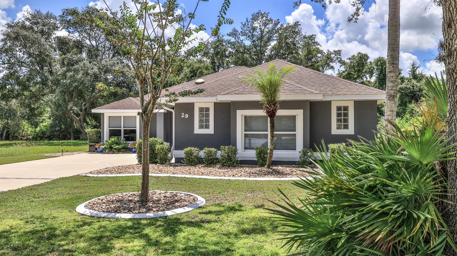 Welcome to
29 Acclaim at Lionspaw , where comfort, style, and an exceptional location come together in one of the most sought-after neighborhoods within the LPGA Golf Community . Offered at $498,000 , this beautifully maintained 3-bedroom, 2.5-bath home with an oversized side-entry two-car garage offers a unique floor plan designed for both everyday living and effortless entertaining. Nestled in the coveted Acclaim at Lionspaw section of LPGA, this pristine home backs to a peaceful conservation area, providing a private, scenic backdrop you'll enjoy year-round. From the moment you enter, soaring vaulted ceilings and abundant natural light create an inviting atmosphere that feels warm and welcoming.
The thoughtfully updated kitchen is the heart of the home, featuring granite countertops, Samsung appliances, a gas range, abundant cabinetry, and generous workspace for preparing meals and gathering with family and friends. Beautiful plank laminate flooring flows throughout the home, creating a stylish, low-maintenance living environment.
One of this home's standout features is its versatile floor plan. In addition to the spacious great room adjoining the kitchen, you'll find a separate family room and a dedicated office, offering flexible spaces for entertaining, working from home, hobbies, or simply relaxing.
The split-bedroom layout provides added privacy. The spacious primary suite is a true retreat with a tray ceiling, large walk-in closet with custom built-ins, dual sink vanity, garden tub, separate walk-in shower, and a private water closet. The guest bedrooms and baths are thoughtfully located on the opposite side of the home, providing comfortable accommodations for family and visitors.
Step outside to the screened porch and unwind while overlooking the tranquil conservation area. Whether you're enjoying your morning coffee or hosting friends for dinner, the porch is the perfect place to enjoy Florida's outdoor lifestyle. A convenient gas hookup is already in place for your grill.
The oversized side-entry two-car garage is a dream, featuring durable epoxy floors, abundant storage space, and room for hobbies, tools, or even a golf cart.
Residents have the option to join the championship golf course, community pool, and fitness center for an additional fee. The community clubhouse also features a popular restaurant and bar & grill that is open to the public, creating a welcoming place to gather with friends and neighbors.
Conveniently located near shopping, restaurants, medical facilities, Daytona International Airport, Daytona International Speedway, Tanger Outlets, and the beautiful beaches of Daytona Beach, this exceptional home offers the perfect combination of privacy, quality, and Florida living. Don't miss your opportunity to own this outstanding home in one of LPGA's most desirable neighborhoods.