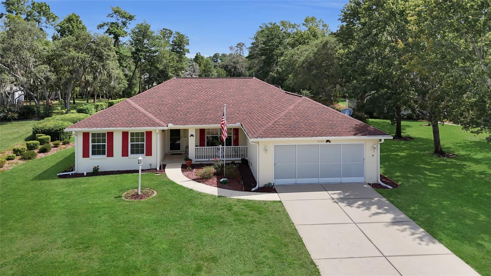 Tucked into Kingsland Country Estates, a 55+ community, this pool home sits on an oversized lot with part of the yard fully fenced. Built in 2001 with 1735 square feet, it offers 3 bedrooms and 2 baths.  Tile floors run through the main living areas with laminate in the bedrooms, and solar tubes in the kitchen and living room keep the space bright all day. The kitchen has a new stove, granite counters, a pantry cabinet, and double roll out shelving in the bottom cabinets, with a nook for everyday meals and a separate dining room for entertaining. The owner's suite has a double vanity, garden tub, step in shower, a separate toilet closet, and a walk in closet. The guest bath includes a tub, tile surround, and linen closet. The laundry room has washer and dryer hookups, a utility tub, and cabinets for storage. The enclosed lanai, with vinyl windows, opens right up to the pool, where the heater and pump were both replaced in 2024. A tile front porch adds another spot to enjoy the outdoors, and the garage comes with built in storage shelving and privacy screens. Out back, a 16x12 shed with new flooring gives you even more storage. To top it off: fiber optic internet, a well for the pool and landscaping, a lightning rod, new toilets in 2024, and an HOA of just $200 a year.