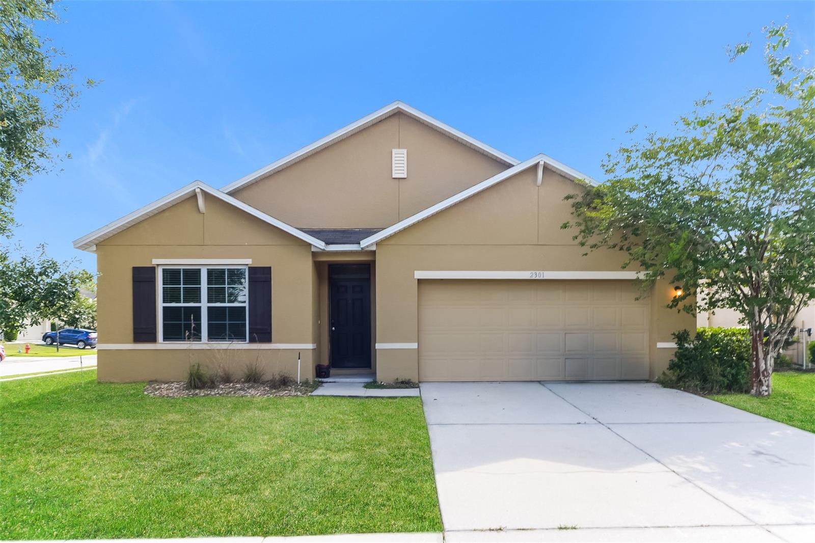 Charm and curb appeal abound for this Davenport home! Step inside the inviting foyer, past the home's three secondary bedrooms, and into the kitchen, which boasts stainless steel appliances, hard surface countertops, and ample storage. The well-appointed living room and dining room are positioned at the back of the home. This ranch style floorplan is rounded out by the laundry room and the primary suite. Come and see for yourself the possibilities that this home has to offer!