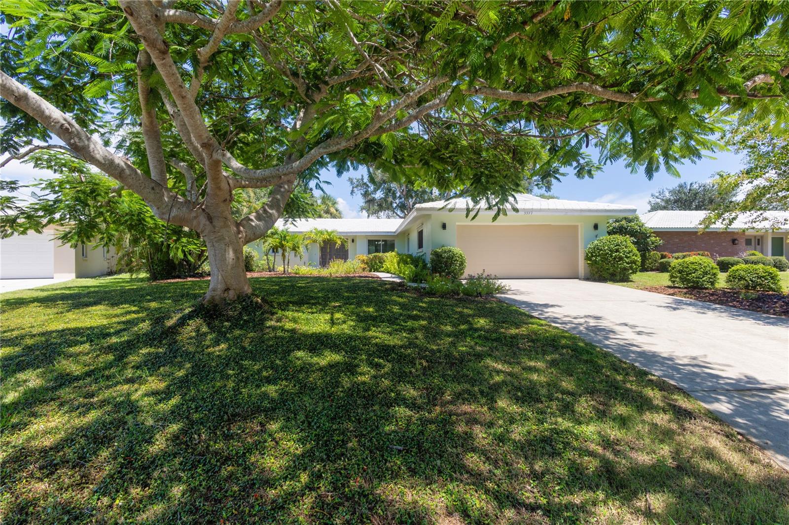 Price Reduced! Beautifully Updated GOLF COURSE Frontage Home with the ABSOLUTE BEST LOT and BEST Panoramic PRIVATE NATURE GOLF COURSE VIEWS in all of Village Green Club Estates! This Lovely HOME FEATURES: 3 Bedrooms, 2 Baths, 3rd Bedroom makes a perfect Den/Flex Room, Master Suite w/Updated Private Bath w/Granite Counters, Walk-in Closet w/Built-ins plus Slider to Covered Lanai, Open Living Room w/Gorgeous Private Panoramic Golf Course Views, Formal Dining Area, Family Room Area, Updated Kitchen w/Granite Counters and Eating Bar, Stainless Appliances, Pantry Closet; Breakfast Nook w/Slider to Screened Lanai, Updated Hall Bath w/Tub and Granite Counters, HUGE Laundry Room Large Enough to be Used as an Office, House Re-Plumb, Updated w/Windows w/Hurricane Shutters, (2007) Roof, (2022-2023) AC and Hot-Water Heater, Porcelain Tile in all areas except the Master Suite and One Guest Bedroom, Oversized 2 Car Garage, Private Paver Patio Shaded by a Majestic Oak Tree and Designer Landscaping w/Irrigation. COMMUNITY FEATURES: Golf Clubhouse is Close-by. NO CDD Fees plus SUPER Low $100 Annual HOA Fees! This is a Fabulous Location close to Everything - Publix Grocery Store, Walmart, Walgreens, Starbucks, Legacy Bike Trail, Downtown Sarasota Restaurants, I-75, UTC Mall and the Siesta Key Beaches!