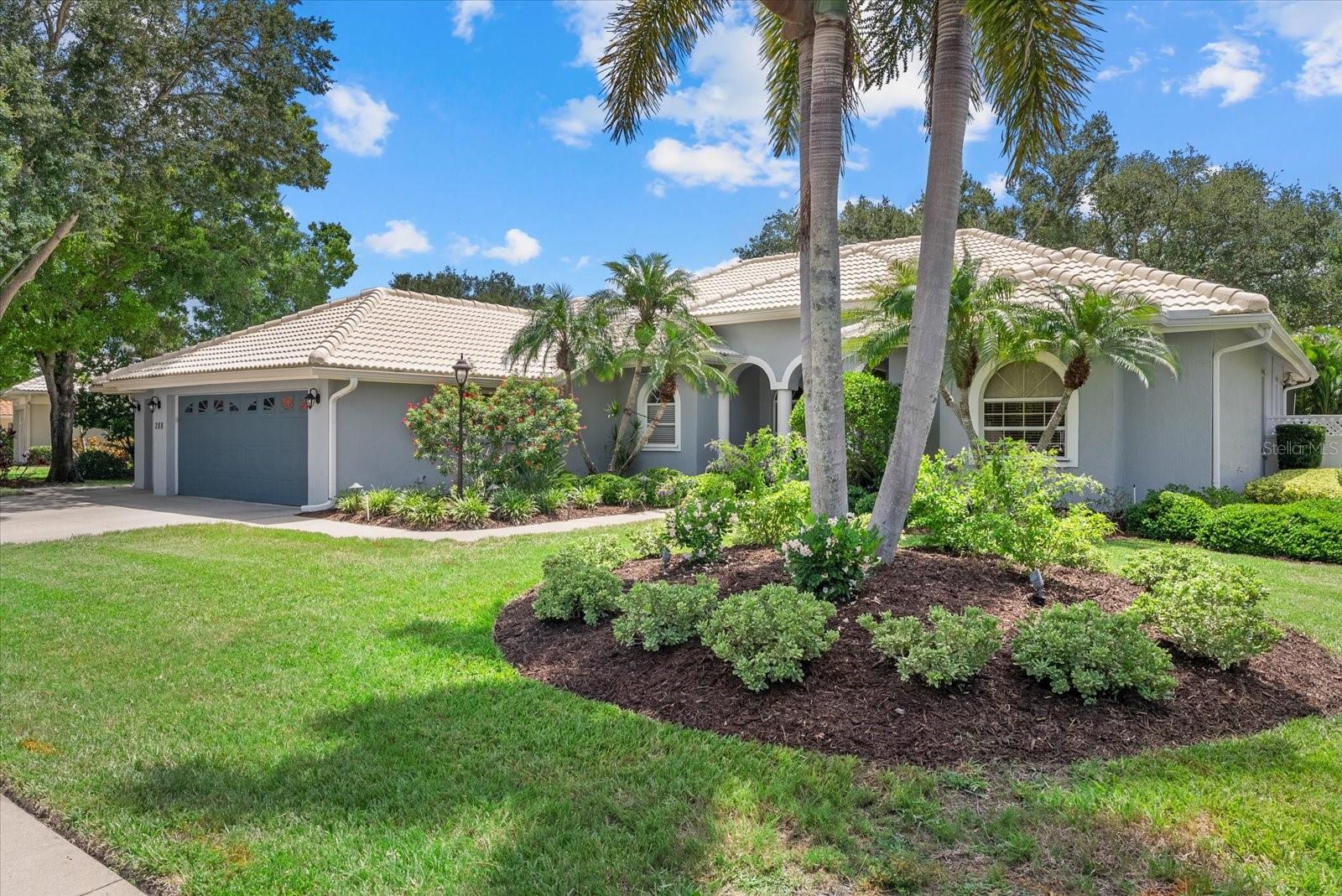 Experience exceptional Florida living in the exclusive gated community of The Venice Golf & Country Club, where a breathtaking canopy of majestic oaks, towering pines, and swaying palms welcomes you home. Perfectly positioned on a beautifully landscaped lot near the Har-Tru tennis courts and the recently renovated Ted McAnlis championship golf course, this custom-built residence offers luxury, comfort, and resort-style living. This spacious three-bedroom, two-and-a-half-bath home has been extensively updated, allowing you to move in with confidence. Recent improvements include beautiful new luxury flooring (2026) throughout the living room, dining room, and all bedrooms, while the kitchen and every bathroom have been completely refreshed (2026) with elegant quartz countertops, stylish new sinks, designer fixtures, and modern faucets, creating a bright, sophisticated interior that today's buyers are searching for. Custom Hunter Douglas window shades throughout the home add a refined finishing touch while providing both style and functionality. Step through the impressive etched-glass double entry doors into a bright, open floor plan featuring soaring ceilings, abundant natural light, and seamless indoor-outdoor living. The spacious living and dining areas overlook the sparkling screened pool and renovated outdoor kitchen, providing the perfect setting for entertaining family and friends or simply relaxing in your own private tropical retreat. Outside, you'll appreciate the extensive investment in the outdoor living space. The new pool cage (10/2023) enhances both beauty and functionality, while the pool heater (5/2022), pool pump (11/2021), and new pool controller and skimmer (04/2025) help ensure your backyard oasis is ready for year-round enjoyment. Additional exterior enhancements include new gutters (03/2021) and a fresh exterior paint finish (07/2023), adding outstanding curb appeal and long-term value. The thoughtfully designed split floor plan offers a luxurious primary suite with privacy and comfort, while the separate guest wing ensures family and visitors enjoy their own private accommodations. Additional improvements include a new roof (2013), re-piped plumbing, hurricane shutters, and exceptional craftsmanship throughout, providing peace of mind for years to come. The oversized two-car garage includes a separate golf cart garage with its own private entrance, plus an adjacent air-conditioned storage room that's perfect for a workshop, hobby room, fitness space, or additional storage. Just a short stroll from the elegant clubhouse, residents enjoy full-service dining, an outstanding fitness center, Har-Tru tennis courts, championship golf, and an active social calendar that defines country club living. Ideally located just minutes from historic downtown Venice, world-famous Gulf beaches, shopping, dining, medical facilities, and I-75, this exceptional home delivers the perfect combination of luxury, convenience, and the Florida lifestyle you've been dreaming of. With major mechanical updates, extensive interior renovations, beautiful outdoor improvements, and a premier location within one of Venice's most sought-after private golf communities, this home is truly move-in ready and offers exceptional value. This is more than a home—it's an opportunity to enjoy one of Venice's premier private golf course communities. Schedule your private showing today and discover why so many are proud to call The Venice Golf & Country Club home