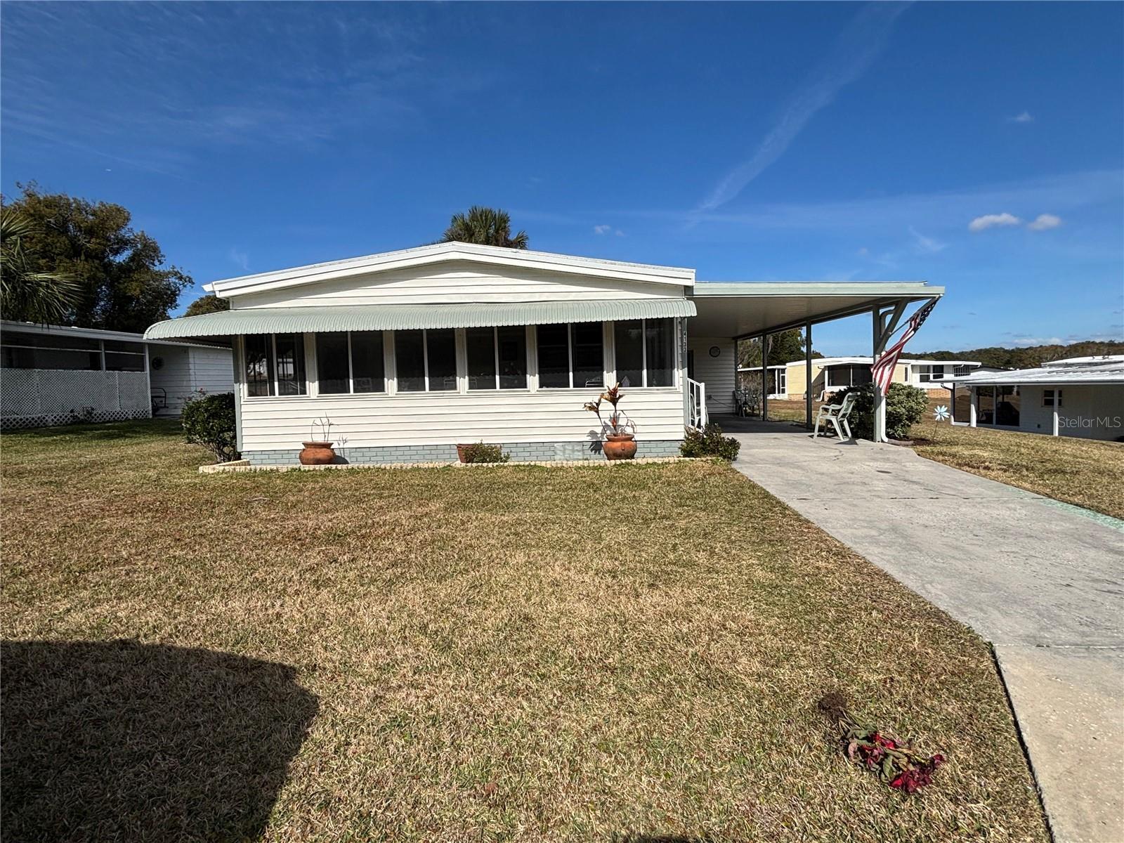 Welcome to Zellwood Station, the sought-after 55+ community! This meticulously maintained home is move-in ready!
This beautifully cared-for residence offers comfort, style, and peace of mind with a long list of valuable updates. The home features a newer roof, (2025) newer A/C, (2025) and new windows, ensuring energy efficiency and year-round comfort.
Inside, you’ll find an updated kitchen and refreshed bathrooms, giving the home a modern, move-in-ready feel. The spacious Florida room provides the perfect spot to relax or entertain, filled with natural light and views of the surrounding property.
There is a laundry/storage room that adds exceptional convenience, offering plenty of space for tools, hobbies, or seasonal items.
This is a wonderful opportunity to own a well-maintained home with meaningful upgrades throughout.
Zellwood Station offers the best in active retirement living, featuring a low HOA fee that covers yard maintenance, driveway cleaning, internet, 24-hour gated security, four pools, pickleball courts, shuffleboard, and access to the community’s popular Whistlestop Restaurant for lunch or dinner. A beautifully maintained golf course is also available for an additional fee.
Conveniently located off the 429 Expressway, the community provides quick access to downtown Orlando, hospitals, airports, and major attractions. You’re also just 20 minutes from historic Mount Dora, known for its charming restaurants, boutique shopping, and year-round festivals. This gem won’t last — contact me today to book your private tour.