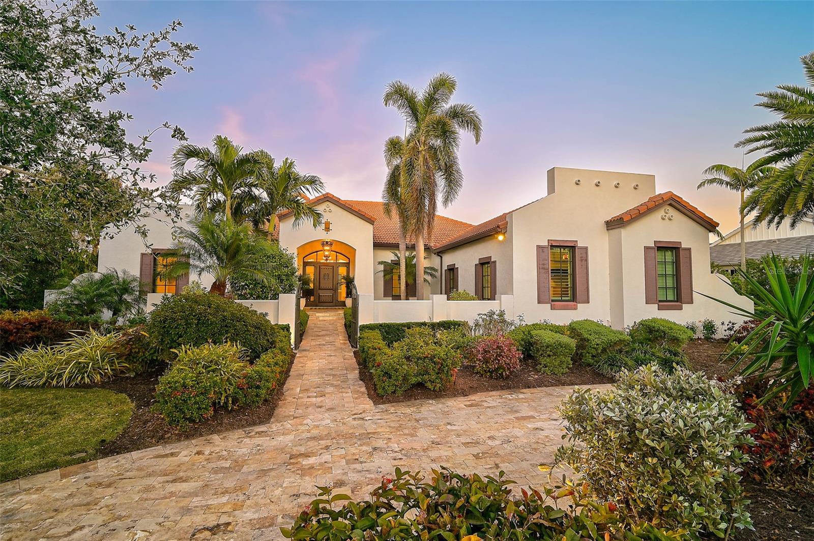 **IMMACULATE ESTATE -- NEWER CONSTRUCTION (2014) -- METICULOUSLY MAINTAINED, MOVE-IN READY, CUSTOM Residence Designed by LAS CASITAS Architects** offers exceptional quality craftsmanship throughout and is located behind the Secure Gates of THE OAKS-BAYSIDE Country Club community.  Situated on an Oversized 0.59 Acre Lot backing to a Tranquil, Coastal Preserve and boasting wonderful curb appeal with its manicured landscape, Circular driveway and Courtyard entryway, this Impressive Spanish-style residence features 3-BEDS plus DEN/STUDY (with built in Murphy Bed), 3 FULL and 1 HALF BATHS and a 3-CAR Garage.  Premium features abound throughout this Light and Bright, Open Floorplan, including Wood and Marble flooring, Crown Moldings, Tray Ceilings, Custom Built-ins and much more!  The sizeable Chef’s Kitchen is a Culinary Dream and features white solid wood cabinets, granite counters, large island with prep sink, counter seating area, premium appliance brands including Thermador, Bosch, etc.  The expansive Primary Bedroom suite entails multiple walk-in closets, primary bath with dual vanities and large, custom-tiled shower.  Enjoy the utmost in Florida, Outdoor Living in your expansive, screened lanai featuring Heated Saltwater Pool, Outdoor Kitchen, ample covered seating areas and stunning natural surroundings overlooking the Coastal, North Creek Preserve.  This “Smart Home” entails Control4 Home Automation, Lutron lighting technology, whole-house water filtration and softener, NEW GENERATOR with 500GAL Propane Tank, Hurricane IMPACT Windows and Doors, 2 Tankless water heaters, etc.  THE OAKS is a distinguished, 24hr Guarded, Country Club Community which boasts many accolades including: Platinum Club of America, Emerald Club of the World, Elite Distinguished Club of the World and One of America’s Healthiest Clubs - where amenities include Three Restaurants, Ballroom, Two 18-hole championship GOLF courses, award-winning RACQUETS program with 12 Har-Tru Hydro-Grid TENNIS courts, 4 PICKLEBALL Courts, wonderful CROQUET facility, state-of-the-art FITNESS center and junior Olympic, heated community SWIMMING POOL, Bocce, Basketball Court, Playground and more! The Oaks is just minutes from nationally ranked Pine View School, the Legacy Bike Trail, area Beaches and all that Gulf Coast living has to offer. Membership is required and there is NO WAITLIST for GOLF or SOCIAL Membership. **ENJOY THE 3D VIRTUAL TOUR and AERIAL VIDEO**