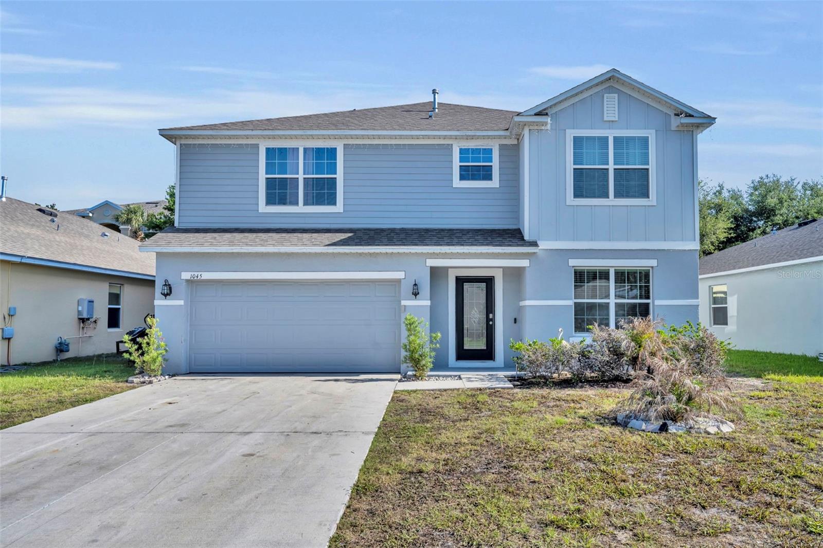 MOTIVATED SELLER!! Welcome to this stunning 2024-built residence offering over 3,000 square feet of thoughtfully designed living space with 5 spacious bedrooms and 3.5 bathrooms. Showcasing more than $45,000 in upgrades, this home perfectly blends modern elegance with everyday comfort. Step inside to an open foyer with soaring ceilings and a dramatic upgraded staircase that creates an impressive first impression. Designer tile flooring, crown molding, oversized baseboards, and a light, neutral color palette flow throughout the home, complementing any style of décor. The gourmet eat-in kitchen is the heart of the home, featuring beautiful wood cabinetry, sleek granite countertops, stainless steel appliances, and an open-concept layout ideal for entertaining. Upstairs, the expanded bonus room provides flexible living space perfect for a media room, playroom, or home office. The luxurious primary suite offers vaulted ceilings, dual vanities, a spacious walk-in closet, and a private water closet for added comfort and privacy. Enjoy Florida living year-round on the screened lanai complete with ceiling fans, overlooking a backyard paradise designed for entertaining. The outdoor space features a bar area, pool table setup, lighting, and grill area, with plenty of room remaining to add a future pool. Additional highlights include a full 2-car garage and thoughtfully upgraded finishes throughout. Schedule your showing today!