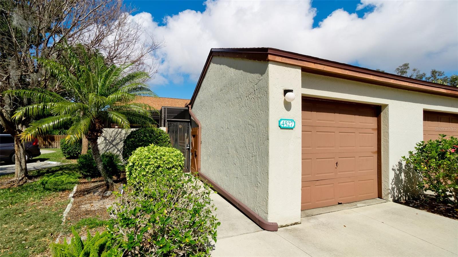 Welcome to this meticulously maintained TURN-KEY FURNISHED 2 bedroom, 2 bath end-unit villa with pride of ownership in the heart of Bradenton at Forty Three West Community. Both front and rear screened spacious brick patios for entertaining, relaxing and enjoying Florida living. Because it is an end-unit your guests can park in the designated space and walk directly into the property for convenience. Open great-room living with vaulted ceilings and skylights. Kitchen is well appointed with sliding glass doors to front patio, box window over kitchen sink for herbs or plants with newer stainless steel appliances (Refrigerator 2025, disposal 2024, range, microwave, dishwasher 2010) and granite counter tops. Florida room has been enclosed with sliding doors (shutters included) across the back over looking the massive screened patio with brick pavers for your outdoor retreat ideal for reading, sunning, dining & entertaining. Utility room off of Florida room has ample space for storage and the washer & dryer 2025. Attached one car garage for parking, storage or workshop. Move-in ready. Furniture can stay or be removed for the convenience of the buyer. Forty Three West offers a community pool, spa, clubhouse and tennis/pickleball courts. Minutes to the beautiful world class beaches, schools, parks, golf, medical facilities, restaurants and shopping.