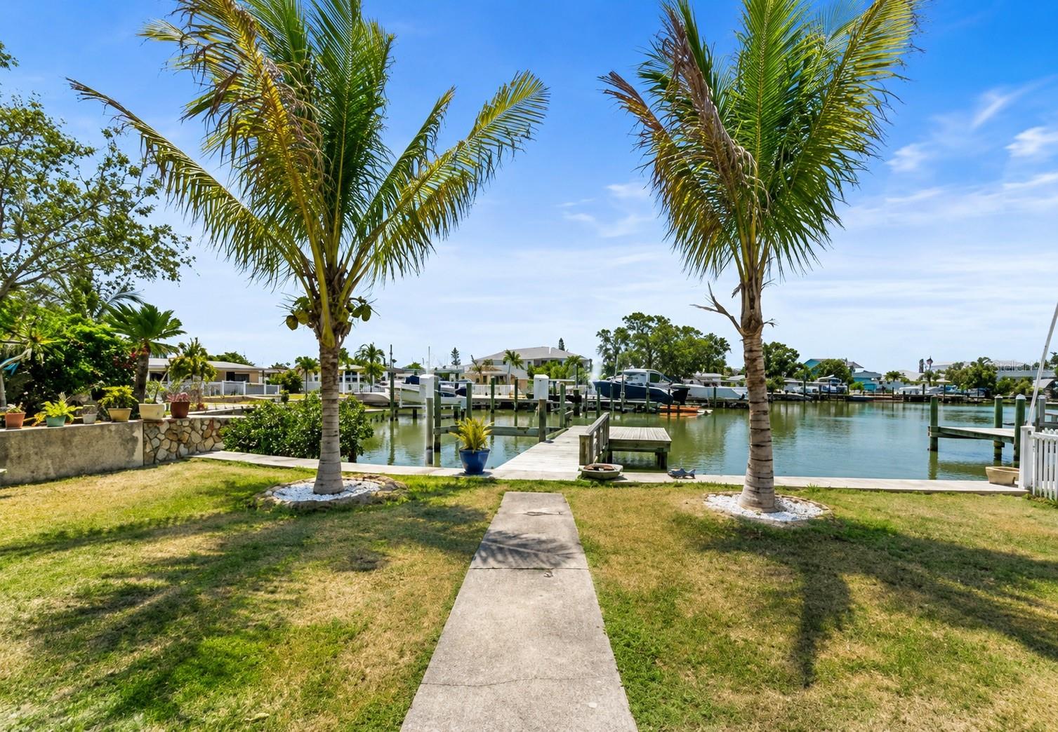 Premier Waterfront Development Opportunity – Madeira Beach. Situated on highly sought-after W Parsley Drive in Madeira Beach, this exceptional waterfront homesite offers a rare opportunity to design and build a custom luxury residence in one of the area’s most desirable boating communities. The existing structure holds no contributory value and is being sold as a tear-down—creating a true blank canvas for your vision. Set along a deep-water, no-bridge canal, the property includes a private dock and provides direct, unobstructed access to the Intracoastal Waterway and the Gulf of Mexico—ideal for avid boaters and those seeking the ultimate coastal lifestyle. This location perfectly balances privacy and convenience. Just a short walk or bike ride brings you to the sugar-sand beaches of Madeira Beach, while nearby John's Pass Village & Boardwalk offers vibrant waterfront dining, boutique shopping, and entertainment. Spend your days on the water, enjoying sunset cruises, fishing, or island hopping right from your backyard. Positioned within easy reach of Tampa International Airport and downtown St. Petersburg, this property offers both accessibility and long-term value in a high-demand coastal market. With strong surrounding development and continued growth in the area, this is an outstanding opportunity for builders, investors, or end-users to create a one-of-a-kind waterfront estate. Build your vision. Capture the lifestyle. Secure your place on the water.