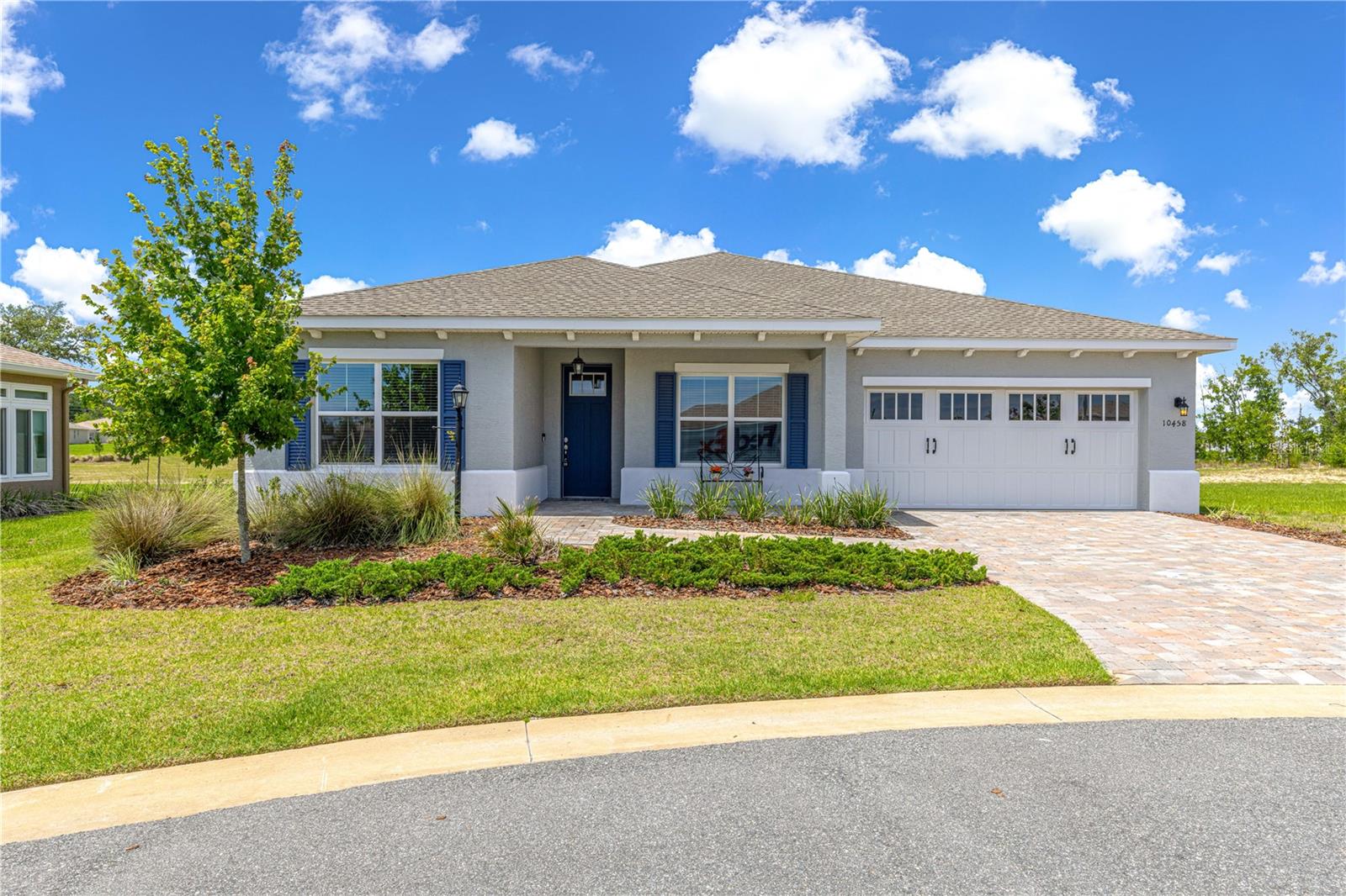 This beautiful Ariana model is located in the desirable LongLeaf Ridge section of the much sought after 55+ community of On Top of the World. It has a 2-bedroom, 2-bath home with a 2-car garage plus golf cart parking, along with a flex space. On a cul-de-sac and a spacious lot with plenty of privacy behind you. Pavered drive and walkway take you into the home. Once inside you will immediately notice the LVP flooring and wide-open floorplan. The living room features a floor to ceiling stacked stone electric fireplace with remote, tray ceiling and large ceiling fan. The kitchen is a chef's dream with a gas range, granite counter tops, dual toned cabinets and a very large island. Top of the line refrigerator and the island have a bar area with cabinets on both sides for even more storage!  Sliders go to your screened in lanai with those private back views. The flex space is the perfect size for an office or hobby room. Primary bedroom with en suite featuring a glass enclosed walk-in shower, private potty area and a double sink quartz vanity. Guests will enjoy a private bedroom filled with natural light, along with a full bath featuring a quartz vanity and tile shower/tub combo. Inside laundry room. The garage has an epoxy coating and plenty of space for a workshop area. Call for your appointment to view today!