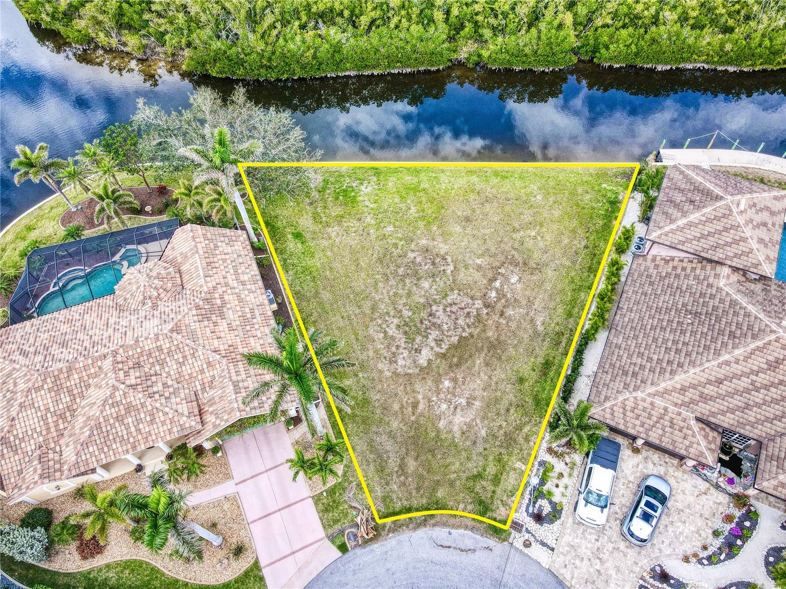 BUILD YOUR DREAM HOME and live the Florida Lifestyle!! SAILBOAT water access to Charlotte Harbor with this OVERSIZED WATERFRONT LOT with 140 feet of water frontage on a cul-de-sac in the highly desired Burnt Store Isles Community. NO HOA FEES!! Need a builder? Let us introduce you to reputable local builders! Burnt Store Isles is an optional HOA, deed-restricted, waterfront, and golfing community with Twin Isles Country Club situated in the center of the community. You can also enjoy all the amenities that Punta Gorda has to offer such as biking, fishing, boating, dining, live entertainment, and much more!