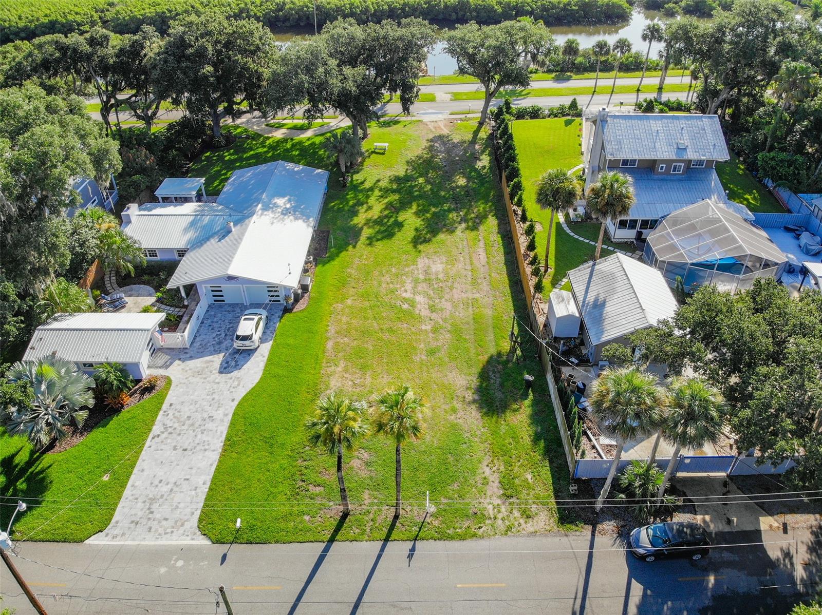 Build your dream home in New Smyrna's Garden District ~Soaring trees and Canal front property located on highly sought after North Riverside Drive. This lot has been cleared and is ready for your dream home to be built. Close to Canal Street or hop in your golf cart for a short ride beachside to enjoy all New Smyrna has to offer.  This lot spans 60 x 209 feet with access to N. Riverside and to Faulkner. NEW BOAT DOCK and LIFT has just been built with plumbing and electricity active and running at dock. Buyer to benefit impact fee credit of 3286 Sq Feet. ** All measurements and information deemed to be accurate Buyer's to verify ** A video of the property can be found on this link : https://vimeo.com/585064601/f85e28cd79 ;Water: Available at Site