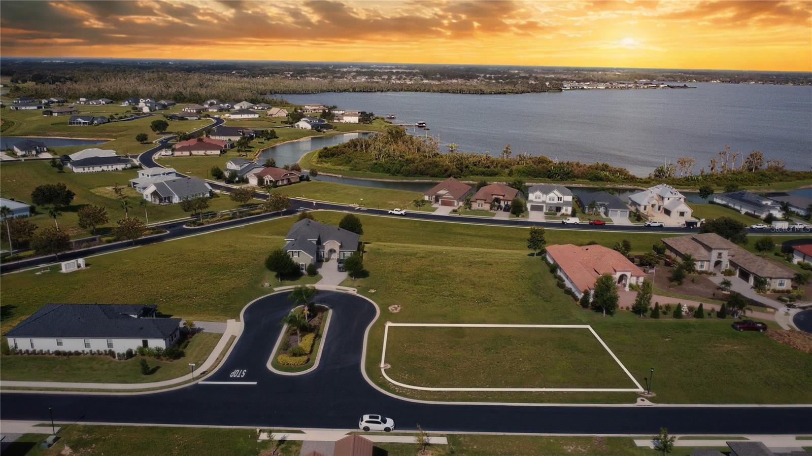 Discover the perfect place to build your dream home on this vacant, leveled lot—ready for immediate construction. located on a quiet dead-end street in a cul-de-sac, this homesite offers extra privacy within the secure gated, custom home community "Water Ridge". Start living the resort-style life every day with access to endless amenities, including a sparkling community pool, lighted tennis and Pickleball courts, basketball courts, renewed fitness center with sauna, fishing pier, and even a community boat ramp for water sport enthusiasts. Golf cart friendly and conveniently located just 35 minutes from Disney, this property combines relaxation, recreation, and unbeatable location all in one.Mo timeframe to start the construction and you can bring your own builder.
