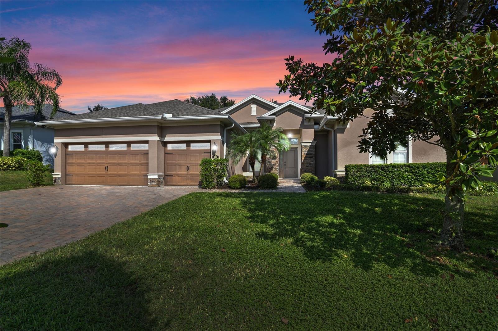 Located in a rare natural gas community, this updated home with 3 car garage and paver driveway offers 4 bedrooms, a private office, and an upstairs media room—the only room on the second floor. New tile flooring has been installed throughout the main living areas, with brand-new carpet in all bedrooms and the media room. The kitchen features a built-in double wall oven and a range with a third oven. Appliances are currently electric, but the home is pre-plumbed for a gas range, gas water heater, and gas dryer. Washer and dryer are included. The media room includes built-in cabinetry. Outside, enjoy an extended screened-in lanai with an upgraded tall screen ceiling. A backyard playground is included, along with a Ring security system. Located in a quiet neighborhood, this move-in ready home offers space and thoughtful upgrades throughout.