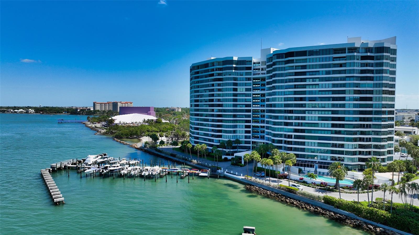 This coveted and rarely available 3 bedroom condo is perfectly sited on the Northwest corner and the 11th floor of 988 Blvd of the Arts, in the premier direct waterfront Condo on the Bay with sweeping and expansive protected views of Sarasota Bay and beyond! Location, location, in the heart of Sarasota and next to The Bay, an exciting new park that has transformed the area into a blue and green oasis with incredible amenities. The 17th stack is the one that is sought-after due to the best views from the wall-to-wall windows in living room, dining room, kitchen and owner's suite! This beautifully renovated unit boasts a sprawling split floor plan, ideal for both entertaining and everyday living, offering an open layout, 3 bedrooms, 2 and 1/2 bathrooms and 2 waterside terraces. Beautifully scaled rooms with sweeping Bay views abound, highlighted by high ceilings, crown molding, and light and bright surroundings. The renovated kitchen has been opened to capture glistening Bay views and features Campbell Cabinetry white shaker cabinets with soft close drawers and pull-out shelves, SubZero refrigerator with 2 convenient freezer drawers, Wolf induction cooktop, microwave and wall oven, and a water treatment system. Under cabinet, and tray ceiling lighting were added to complete the beautiful and efficient kitchen workspace. Enjoy the glorious azure water views from your spacious owner's suite featuring an expansive walk-in closet, 2 additional storage/linen closets and the chic ensuite bath with double sinks, ample cabinetry, granite countertops, deep soaking bathtub and large glass and tile surround walk-in shower. A private guest wing which boasts 1 and 1/2 baths and in-unit laundry room, is tucked away on the opposite side of the condo. Both large guest bedrooms feature walk-in closets while the third bedroom has sliding doors out to a water/city view terrace. Either space could easily be utilized as a home office. Exotic African Sapele wood floors are featured throughout the main living areas with porcelain tile in both kitchen and all baths. Sliding glass doors are hurricane/impact rated. The condo has a designated storage unit and covered parking. Condo on the Bay is located in downtown Sarasota on its own 24-hour guard gated 9-acre peninsula. This amenity rich property offers luxurious living in a well-appointed building and recently renovated lobby, with amenities including resort style pool, 2 lighted tennis/pickleball courts, fitness room with sauna, showers, free weights, circuit and cardio machines, concierge, convenient porte cochere, boat docks and kayak racks and lifts if available. Condo on the Bay is a pet friendly community with informal, organized social activities including happy hours, trivia nights, mahjong, walking and biking groups. Enjoy the conveniences of Downtown living, steps to the Van Wezel Performing Arts Center and the new 50+ acre Bay/Bayfront Park which will feature walking trails, playground, snack shop, fine dining and retail. All within close proximity to St. Armands and #1 rated beaches. Do not miss out on this exceptional residence in an outstanding location!