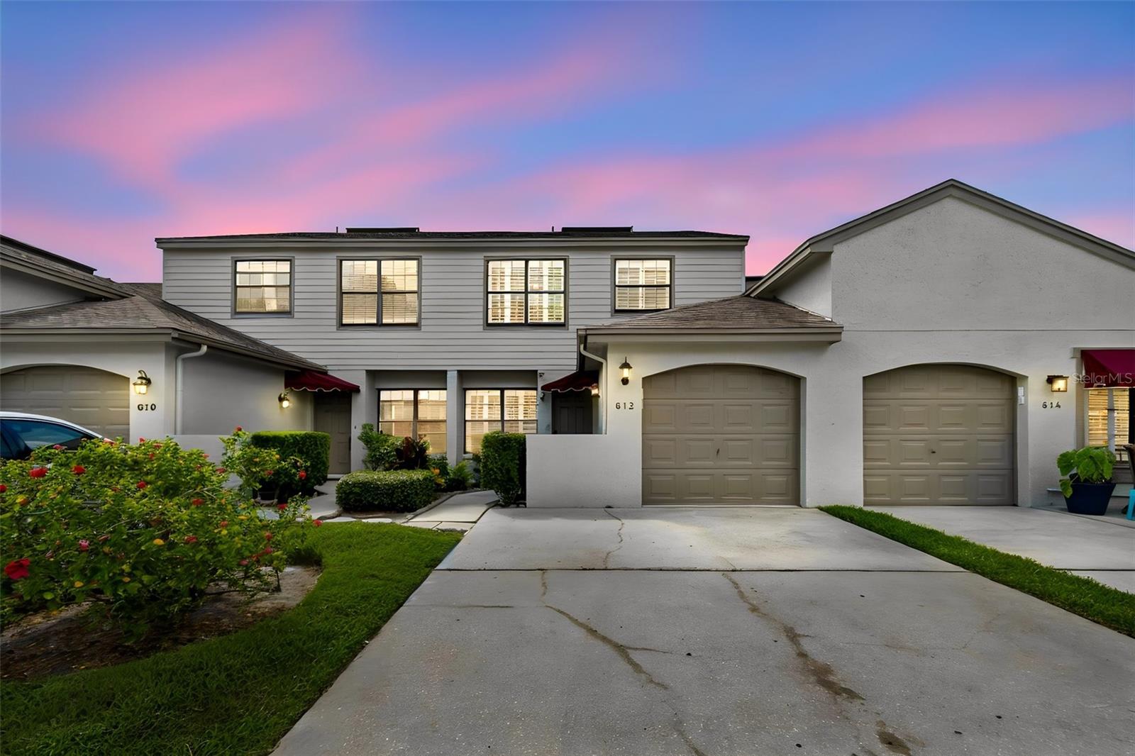 One or more Photos Virtually Staged.  This pristine residence offers 1531 square feet under air, with 3 bedrooms, 2+1/2 bathrooms, and a 1-car garage, plus an enclosed lanai. Beautifully updated kitchen featuring custom solid-wood cabinetry with pull-out shelving, granite countertops and backsplash, stainless steel appliances, and a cozy eat-in space. Enjoy the community pool and nearby Marshall City Park with playground, basketball, tennis and pickelball court. The townhouse features open floor plan, custom kitchen cabinets, tiled floor on first floor stairway and both bathrooms.  The bedrooms have wood laminate floors. The A/C heat pump is newly installed and checked June, 2026.  Includes water softner. This well-maintained community offers an HOA that includes roof replacement (2022), exterior and grounds maintenance, and a community pool. Just 1.5 miles from Downtown Safety Harbor’s Main St. Tampa International Airport,