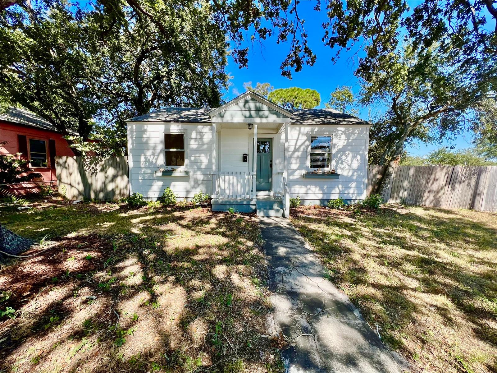Experience the allure of St. Petersburg living within this enchanting 2-bedroom, 1-bathroom bungalow. Radiating with original hardwood floors, this residence emanates a timeless warmth and character throughout. Nestled on a fully fenced corner lot, privacy and security are assured. The detached garage, accessible via an alley, presents convenient parking and additional storage options. The expansive gated backyard is a versatile feature, accommodating boat, trailer, or RV storage, catering to your adventurous spirit. Inside, the modern kitchen is a culinary haven, adorned with stainless steel appliances that elevate its sophistication. The fully remodeled bathroom offers a contemporary sanctuary, evoking a spa-like ambiance within your abode. Enjoy comfort in the carpeted bedrooms and embrace the natural light streaming through the French doors that unveil a bonus room. This adaptable space can function as a spare bedroom, playroom, or productive workspace, offering limitless possibilities. For added convenience, washer and dryer hookups streamline laundry days. Pets are welcome, with no aggressive breeds permitted. Beyond just a home, this St. Petersburg bungalow is a canvas for your lifestyle, harmonizing classic charm with modern amenities. Seize the opportunity to claim this bungalow as your own and immerse yourself in the vibrant St. Petersburg lifestyle. Welcome home!  In addition to the advertised base rent, all residents are enrolled in the Resident Benefits Package (RBP) for $50.00/month which includes HVAC air filter delivery, credit building to help boost your credit score with timely rent payments, utility concierge service making utility connection a breeze during your move-in, and much more! More details upon application.  Pets welcome, owner approval required. Occupied and will be available as soon as 08/01/2026!