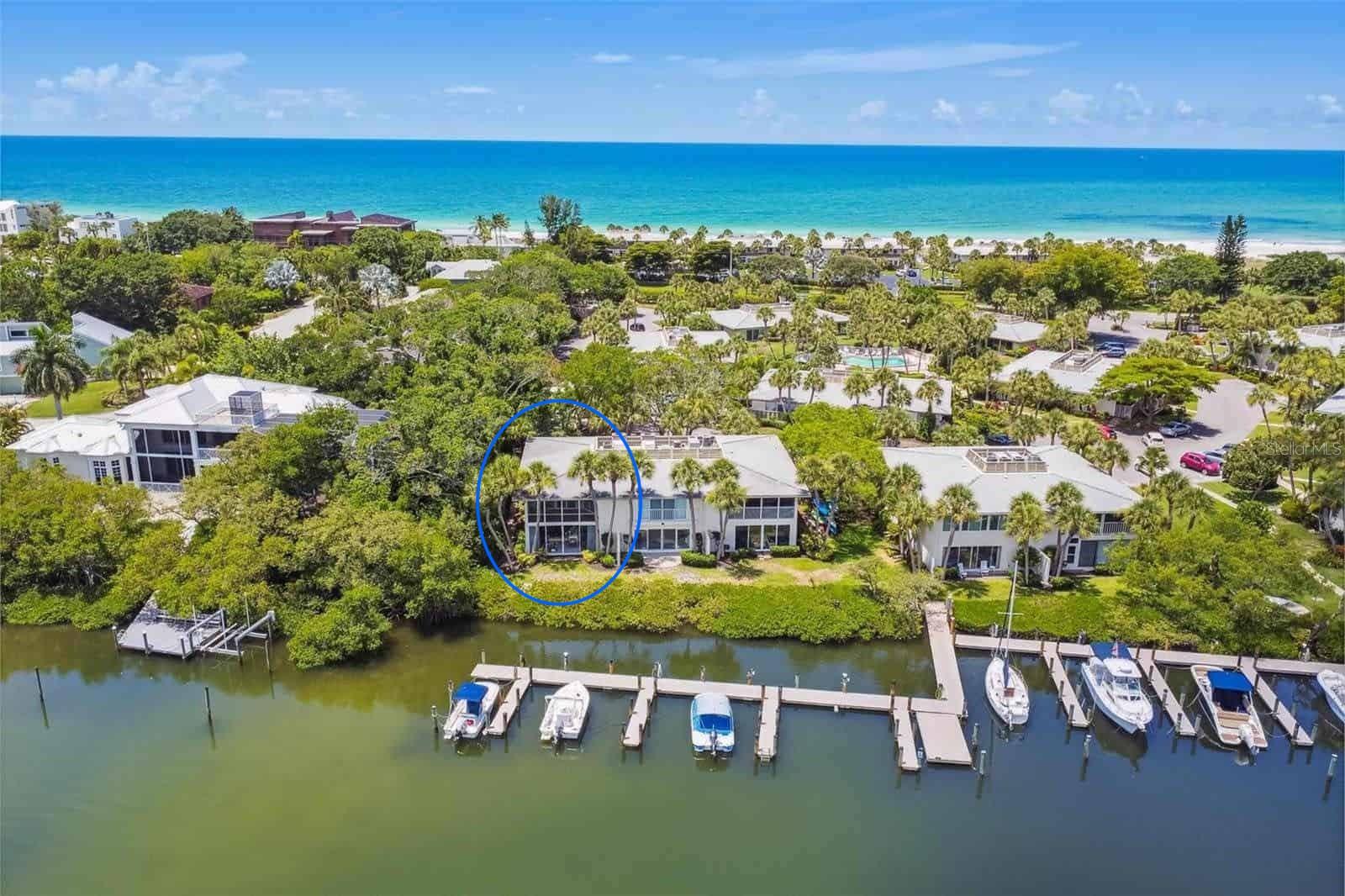 Welcome to 6700 Gulf of Mexico Drive #117, a beautifully reimagined end-unit 2-bedroom, 2 full bath residence in the sought-after Whitney Beach community on Longboat Key. Taken down to the studs and completely renovated, this waterfront condominium offers coastal living with sweeping views of Bishop’s Bayou, abundant natural light, and exceptional privacy. A private front courtyard welcomes you inside, where new high-end luxury vinyl plank flooring flows throughout, and a bright, open layout immediately draws your eye to the water. As an end unit, additional windows enhance the airy feel, while hurricane-impact windows and sliding doors frame tranquil bayou views. From the main living space—and even from the primary bedroom upon waking—you’ll enjoy peaceful scenes of dolphins, manatees, and glowing sunsets reflecting across the water. The fully redesigned kitchen is both stylish and functional, featuring granite countertops, soft-close cabinetry, custom glass-front accents, classic subway tile backsplash, designer pendant lighting, peninsula seating for four, and a full suite of GE stainless steel appliances—all positioned to capture the water views. Both bathrooms have been completely renovated with glass walk-in showers, elegant tilework, and quartz-topped vanities, offering a clean, modern aesthetic. A new Whirlpool stackable washer and dryer adds everyday convenience. Whitney Beach is a unique beach-to-bay community with deeded private access to the Gulf just across the street. Residents enjoy resort-style amenities including pools, tennis courts, shuffleboard, barbecue areas, kayak storage and launch, walking paths, and a tranquil bayfront pavilion. Boat slips are available when offered, and the community pier provides a charming setting for fishing or relaxing by the water. Ideally located on the north end of Longboat Key, this residence offers easy access to Anna Maria Island, as well as the dining, shopping, and cultural attractions of Sarasota. Whether as a full-time home, seasonal retreat, or investment, this is an exceptional opportunity to enjoy the best of bay-to-beach living. Professional photos coming soon.