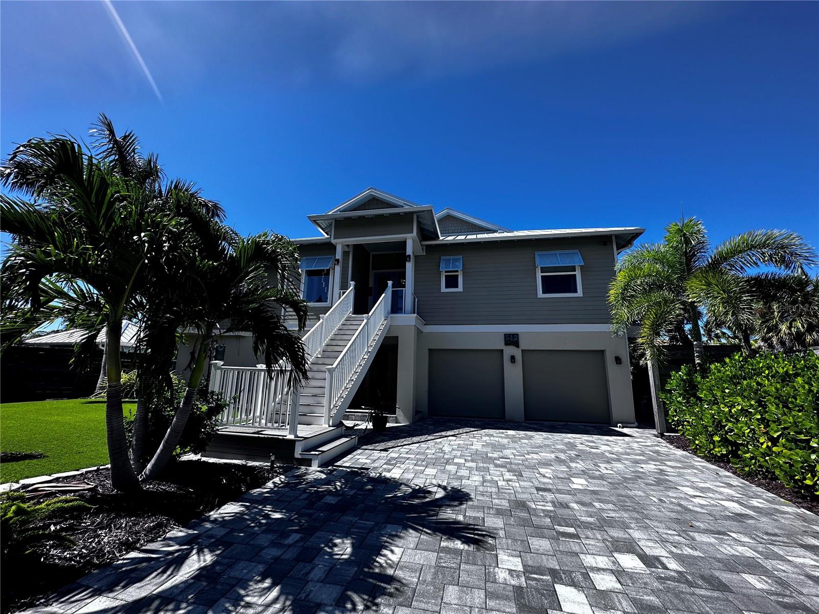 Custom Pool Home with Dock & Boat Lift with direct access to Intercoastal Waterway & Gulf of Mexico.  This custom 2 story home was built in 2018 with no detail overlooked. Once you enter the front doors the view of Lyons Bay is stunning with 180 feet of frontage and a 10,000-pound boat lift and dock. This open floor plan has pocket doors with zero edges that lead you to the large balcony for entertaining and watching amazing sunsets. The kitchen features all high-end appliances, drawer dishwater, drawer microwave, gas cooktop, double ovens and two refrigerators for plenty of storage!  Master bedroom has large walk-in closet with ample storage, French doors lead to balcony.  The master bathroom features: his/her vanities and toilets with large walk-in shower with dual shower heads centered in the middle. The other two bedrooms share the second bathroom with double vanities and shower/tub. The pantry and laundry room are conveniently located off the kitchen for all your additional storage needs.  Don't forget the ELEVATOR - handy for moving things upstairs or grocery shopping! The downstairs area has been enclosed as an additional flex space (1,600 sq.ft) and pool bath.  Outdoor entertaining space is large upstairs and downstairs balcony space and cabana near the pool with additional deck space and firepit overlooking the bay. Pool and hot tub are heated.  Directly behind the cabana is the outdoor kitchen with gas grill.  Golf cart garage is located on this side of the house making for easy access from the pool to inside or storage for outdoor toys (bikes, paddleboards, etc.). Over 3,000 sq ft of brick pavers outside for walkable access from front to back.  Low/No Maintenance yard with artificial turf in the front and lots of self-grooming palms throughout the yard. 8-foot privacy fence and mature Pitch Apple plants gives you all the privacy you want! No Storm Damage.  Hurricane Impact Windows & Doors. Great location with easy access to downtown Venice or a short drive to Sarasota.  Nokomis Beach is less than a mile away, close to nearby shopping, easy access to I-75, Legacy Trail and close to Sarasota Memorial Hospital's Venice location. Homeowners Insurance $4,975