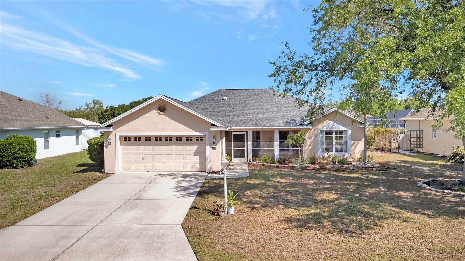 Imagine waking up each morning to the beauty of sparkling lake views right outside your window—this is the ultimate Florida lifestyle awaiting you in this exquisitely updated lakefront home boasting a private screened-in pool and breathtaking water views. This turnkey property offers the perfect blend of modern elegance, comfort, and peace of mind, having been meticulously upgraded from top to bottom with a brand-new roof installed in July 2023 for years of worry-free living and added long-term value. The heart of the home shines with a fully updated kitchen featuring elegant new granite countertops, a matching backsplash, and top-of-the-line appliances including a new Samsung refrigerator, Bosch dishwasher, and a new Samsung washer and dryer for effortless daily living. Step inside to discover beautiful new luxury waterproof vinyl flooring that flows seamlessly throughout the main living areas and all three bedrooms, creating a clean, stylish, and durable foundation for your family, complemented by all-new light fixtures and five new matching ceiling fans with remotes that deliver both beautiful ambiance and practical comfort in every room. Outside, your private oasis comes with a completely rescreened lanai, a new pool pump and filter for crystal-clear swimming, and upgraded outdoor lighting that elegantly illuminates the entire home and pool area—setting the stage for unforgettable evening gatherings with friends or quiet, relaxing nights. Additional smart upgrades include a full ADT security system with cameras for added safety, new light switches throughout the home, and surge protectors installed on the AC unit and electrical panel to protect your investment. Nestled in the charming, well-maintained Sugar Mill Lakes community, this lakefront retreat provides exclusive access to wonderful recreational amenities, including a playground with a picnic area, tennis court, and basketball court—perfect for active families or weekend enjoyment. Whether you're seeking a peaceful waterfront escape or a vibrant community setting, this exceptional move-in-ready home delivers it all and is priced to sell with recent upgrades that make it a rare lakefront opportunity that won’t stay on the market long. Don’t miss your chance to own a slice of Florida paradise—schedule your private showing today and start living the lakefront dream!