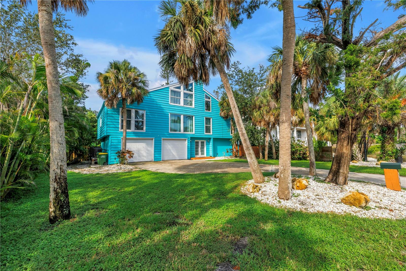 Situated in the sought-after Bay Isle community on Siesta Key, this exceptional three-level pool home combines the best of upscale coastal living with impressive rental performance. Designed to host gatherings of all sizes, it is perfectly suited as a primary residence, vacation escape, or income-producing property. In 2024, it brought in $132,419 in gross rental income, with 2025 projections at $120,681, showcasing its strong investment appeal.
Just a short stroll to Shell Beach and minutes from Siesta Key Village and the world-renowned Siesta Key Beach, the home offers unmatched access to award-winning white sand, vibrant dining, and boutique shopping. A complete renovation in 2019 transformed the property with a new metal roof, hurricane-impact windows, patio and garage doors, upgraded AC systems, and an oversized resurfaced lap pool with all-new equipment, including a heat pump. Over 50 Areca palms frame the lush tropical landscaping, providing beauty and privacy while remaining easy to maintain.

The outdoor living space rivals a private resort, featuring a sparkling pool, spacious patio, and tranquil surroundings ideal for lounging or entertaining. Inside, natural light fills the open floor plan, creating seamless flow to the outdoor areas and making it a true entertainer’s haven. Impeccably maintained and move-in ready, this Bay Isle residence offers a rare opportunity to enjoy the island lifestyle while benefiting from consistent rental income.