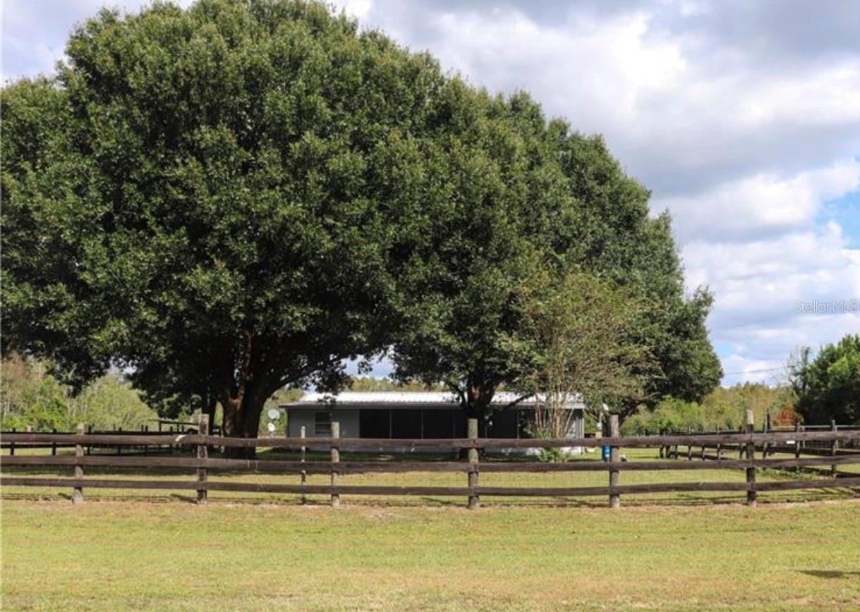 Come see what off the grid county living is all about with this beautiful fenced 7.63 acres with its own fish stocked pond. Come enjoy peace and quiet, all while having the perfect spot to entertain your friends and family. Wonderful place to start or raise your family, with plenty of space for all of your toys and animals. The mobile home features an updated interior, with a modern open concept kitchen and newer flooring. The pole barn gives extra convenience to store your outdoor equipment or use for barn space for your livestock. Gorgeous views from your front or back porch, to sit and enjoy dinner and drinks outside. This place offers it all, call today for your private showing.