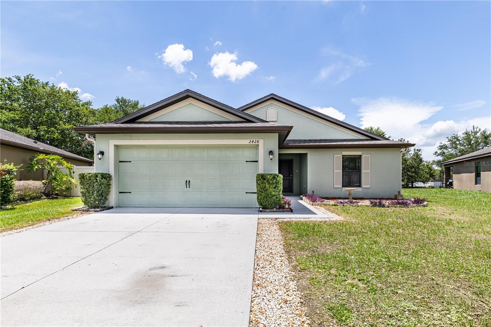 2428 Bexley Dr | Amazing Location | Low HOA | This well-maintained 3-bedroom, 2-bathroom split floorplan home in Tavares is a must see! Built in 2018 and owned by just one family. Fresh interior paint and high-quality luxury vinyl plank flooring throughout the main living areas and two of the bedrooms give it a clean, modern feel, while newer carpet in the primary bedroom adds a cozy touch. The kitchen features brand new appliances and a dinette area — perfect for casual meals or morning coffee. A separate family room offers great flexibility and could easily serve as a home office or a dedicated homeschool space, making it a smart fit for today's lifestyle. The split floorplan gives everyone their own space, with the primary suite tucked away for added privacy. The primary bedroom offers a walk-in closet and an en-suite bathroom. The primary bath offers a large vanity, shower with a tub. The inside laundry room is located off of the kitchen that leads you into the 23x20 garage. Outside, the oversized lot with no rear neighbors means you've got room to breathe and a backyard you can actually enjoy. The covered rear porch is a perfect spot to wind down after a long day. Schedule your private showing today! Make sure to watch the Video tour and some photos have been virtually staged.