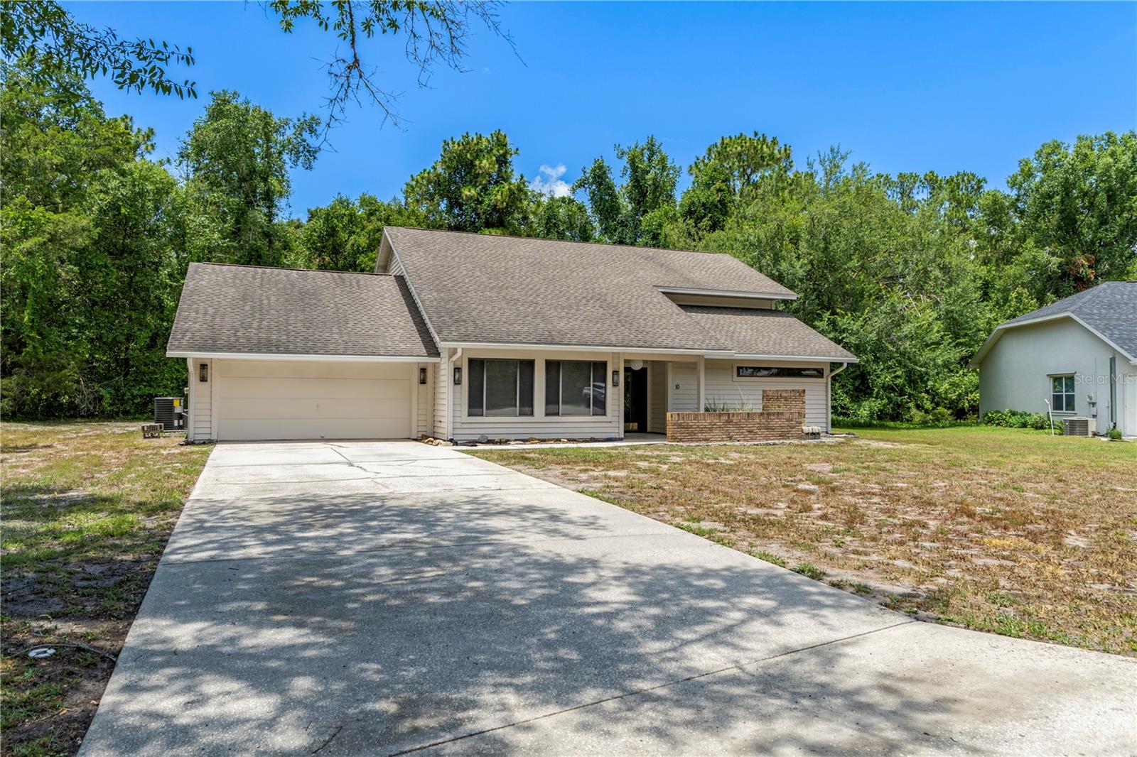 Spacious pool home on an oversized 0.55-acre corner lot in Sugarmill Woods! Features a NEW downstairs A/C (2026), with the upstairs A/C, roof, and water heater all replaced in 2011. Offering over 2,600 SF of living space, this thoughtfully designed home features a spacious first-floor primary suite, plus three additional bedrooms and a large family room upstairs. A loft overlooking the impressive living room with soaring ceilings and abundant natural light adds to the home's open feel. Enjoy the screened pool and the added privacy of the adjoining lot, combined into one parcel totaling approximately 0.55 acres. Conveniently located near golf, shopping, dining, medical facilities, the Suncoast Parkway, Crystal River, and the Gulf. Schedule your showing today!