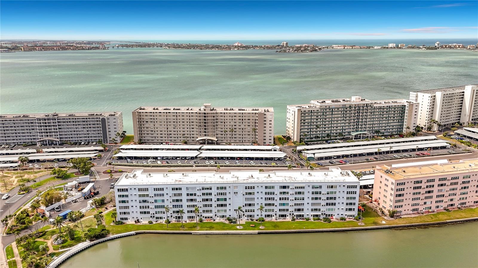 Welcome to Town Shores of Gulfport! Join the FUN at this 55+ waterfront community nestled along the sparkling shores of Boca Ciega Bay. Enjoy effortless coastal living in this beautifully maintained 1 Bedroom 1 Bath DELUXE unit offering 1060 Sq Ft of living space.
Step inside to find a spacious open floorplan with a well-appointed kitchen boasting stainless steel appliances, granite counter tops, and a NEW Gas Range! Additionally, there is a generous sized bedroom with a custom built walk-in closet, an updated bathroom with a walk-in shower, and a spacious Florida room with an office space.  Easily transform that office space into a guest space - a full-sized Murphy Bed is included!
Notable features include a NEW HVAC unit, Hurricane rated impact resistant windows, NO popcorn ceilings, a NEW exterior storm door, a large storage closet in the Florida Room, custom solar window shades, extra storage on the same floor, a NEW roof on the building, and a NEW hurricane rated carport!   Enjoy your morning coffee or evening sunset hues looking through the large double paned windows that frame peaceful marina views.
Enjoy resort-style amenities, including FOUR heated pools, tennis and pickleball courts, shuffleboard, a fitness center, library, billiards, kayak storage, and a scenic waterfront walking path. Town Shores of Gulfport is just a short stroll from downtown Gulfport’s charming arts district, with its shops, restaurants, weekly markets, and vibrant nightlife! Whether you’re seeking a seasonal retreat or a full-time coastal residence, this condo offers the perfect blend of comfort, convenience, and Gulfport charm.
