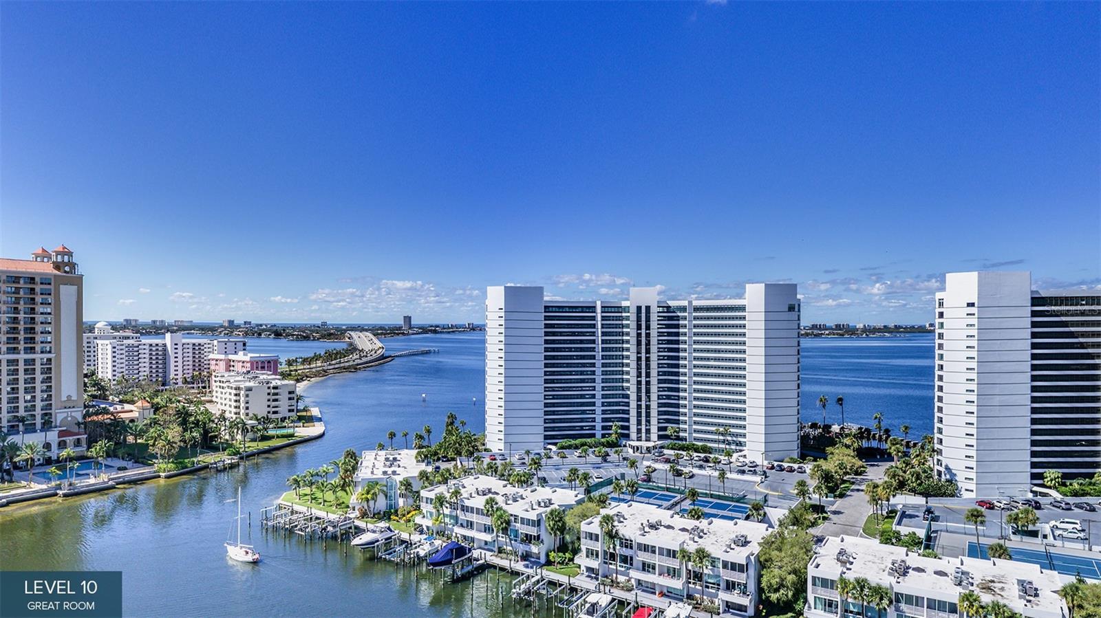 One or more photo(s) has been virtually staged. Pre-Construction. To be built. Sweeping bay views welcome you the moment you enter Residence #1103 at The Ritz-Carlton Residences, Sarasota Bay. In a striking 20-story waterfront tower in Sarasota’s accessible downtown cultural district, this Residence C floor plan blends sophisticated design with effortless coastal living. Designed for entertaining, the expansive great room opens to a large private terrace overlooking Sarasota Bay through floor-to-ceiling glass doors. The open-concept kitchen features an oversized walk-in butler’s pantry, while a separate den provides flexible space for work or relaxation. Two guest suites with en-suite baths share a private terrace with sparkling city views, while the primary suite enjoys breathtaking bay vistas, dual walk-in closets and a spa-inspired bath with soaking tub, double shower and dual vanity. Ownership within a Ritz-Carlton branded residence offers the rare advantage of legendary service, global brand recognition and a lifestyle curated by one of the world’s respected hospitality names. Residents enjoy 24-hour concierge and valet, food and beverage service, and membership to The Harbor Club, featuring nearly 20,000 square feet of social, fitness and wellness amenities, including Sarasota’s first indoor pickleball court within a luxury-branded residence. Scheduled for completion in Q4 2026.
