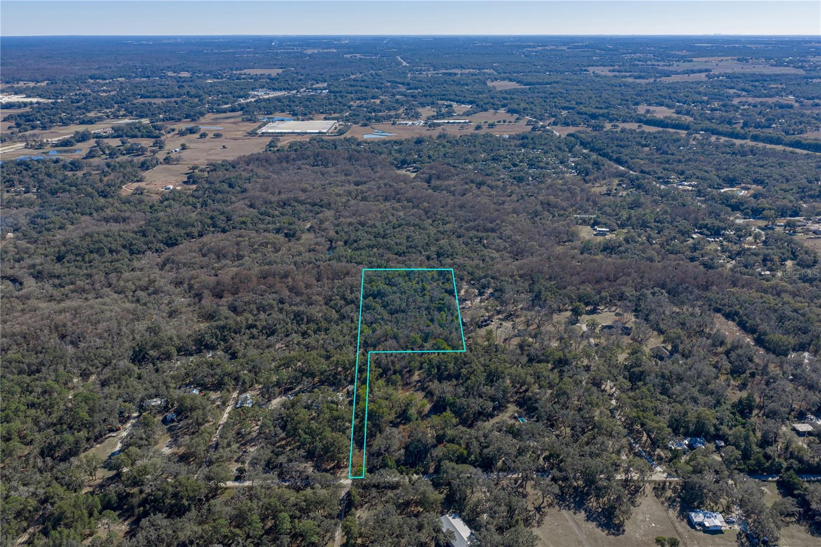 Discover 5 acres of possibility in north Dade City, a wooded sanctuary set away from the road,
where your vision can take root without the constraints of HOA rules. This agricultural-zoned
property gives you the freedom to build a single-family home or place a mobile home, all while
surrounded by mature trees that offer natural privacy and a tranquil backdrop. Whether you're
dreaming of a private escape or planning agricultural ventures, this land delivers that coveted
rural character while keeping you close enough to town for everyday needs. No impact fees have
been paid, no well or septic in place. Call us today to see if this tranquil piece of property is the
one for you!