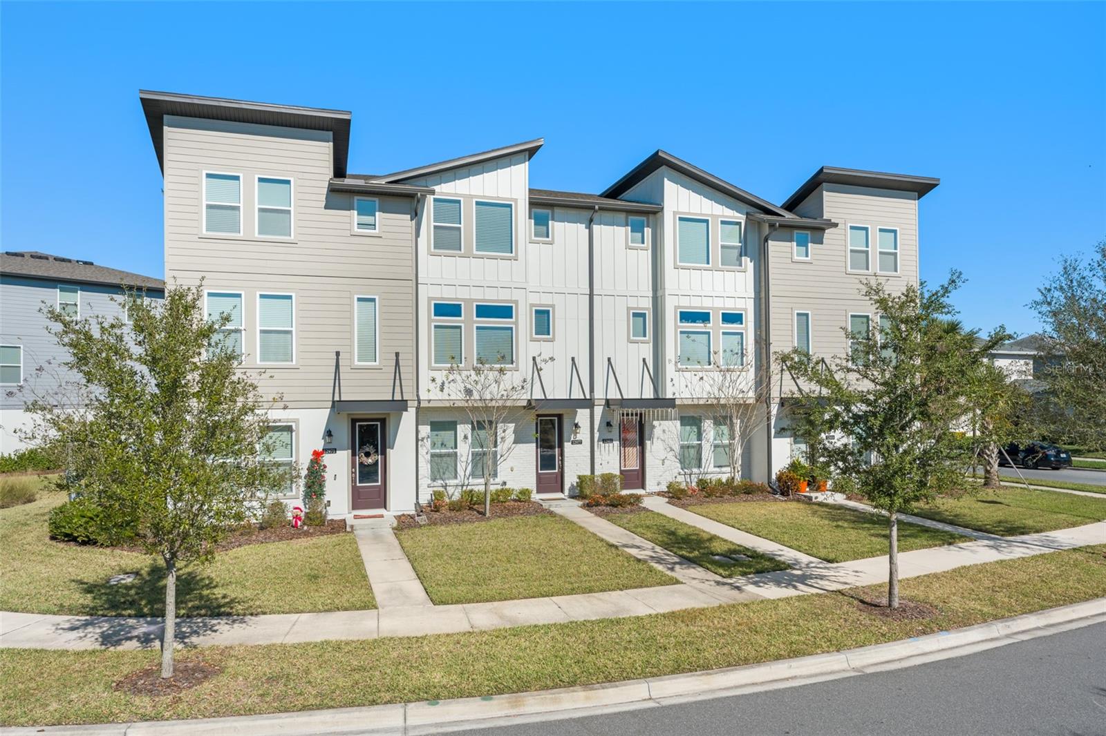 Welcome to Laureate Park, Lake Nona—an extraordinary community that epitomizes the spirit of progress and innovation. Located in one of Central Florida's most desirable and rapidly expanding areas, this 17-square-mile haven is adjacent to the Orlando International Airport. Nestled in the heart of Lake Nona, Laureate Park is within walking distance of world-class medical facilities and just minutes away from the bustling Lake Nona Town Center, where you can explore an array of shops, restaurants, and vibrant events throughout the year. This community boasts unparalleled amenities, including an outdoor aquatic center, a community gym, miles of scenic walking trails, and several serene parks. Introducing a magnificent Haines townhome, crafted by Ashton Woods at the end of 2021, offering stunning water views. This pristine residence features three bedrooms, three bathrooms, and one-half bathroom. The first floor welcomes you with a private bedroom, complete with a walk-in closet and an en-suite bathroom. Ascend to the second floor to discover an expansive open-concept space, where the kitchen, dining room, and family room seamlessly blend together, all overlooking the tranquil water. The kitchen is a chef’s dream, adorned with Designer Wellborn cabinetry, Whirlpool stainless steel appliances, and luxurious granite countertops with a 4" backsplash. Adjacent to the kitchen, the dining area opens onto a private balcony, perfect for soaking in the beauty of Laureate Park. A conveniently located half bathroom is just steps away from the stairs, ideal for guests. On the third level, an office with breathtaking water views offers the versatility to serve as an additional guest bedroom, complete with a walk-in closet and an en-suite bathroom with a shower. Down the hall, the master bedroom is a retreat unto itself, featuring an oversized walk-in closet, a lavish master bathroom with dual vanities, and a glass shower equipped with multiple shower heads. This townhome comes partially furnished, including all necessary kitchenware. Discover the perfect blend of luxury, convenience, and innovation at Laureate Park, Lake Nona. Your future awaits.