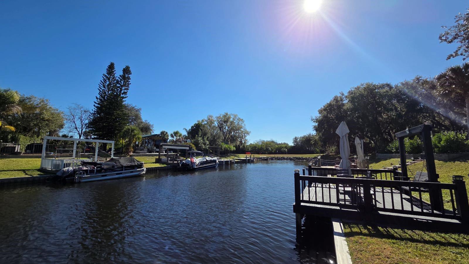 WATERFRONT RV LOT FOR SALE!  Experience the pinnacle of "Cowboy Luxury" with this Direct Waterfront RV Lot at 451 Waterway Dr! Situated in the highly sought-after Phase 5 of River Ranch RV Resort, this 40x92 lot offers a rare opportunity for both personal enjoyment and turnkey rental income. This RV Lot is a Boater's Dream and includes a private dock with several seating areas and room to improve and provides direct access to the Kissimmee Chain of Lakes.  Spacious & Shaded: This big-rig friendly lot features a beautiful canopy of oak trees, offering the perfect blend of sun and shade. Privacy: Strategically located with common area directly across the street, ensuring added privacy and no immediate neighbors in front. Room to Grow: Ample space for outdoor dining and the potential to add a custom pavilion or outdoor kitchen.   Resort Amenities: River Ranch is Florida’s premier luxury RV destination, located just 1 hour south of Orlando. Owners enjoy access to an Owners Lounge, Billiards Room, Poker Room, Fitness Center and More!   Endless Entertainment: Weekly live rodeos, a family-friendly saloon with live bands, and line dancing. Family Fun: Waterpark, petting farm, airboat rides, mini-golf, and a full adventure park.  On-Site Dining: Fine dining at the Chop House, waterfront BBQ at the Smokehouse Grill, and a Starbucks-serving coffee shop.  Investment Opportunity: With Seller Financing Offered, this lot is an accessible investment in a high-demand vacation destination. The low-maintenance lifestyle is supported by a $942/quarter HOA that covers water, sewer, cable, internet, lawn care, trash, and 24/7 security. This pet-friendly resort has no RV restrictions, making it perfect for weekenders or snowbirds.