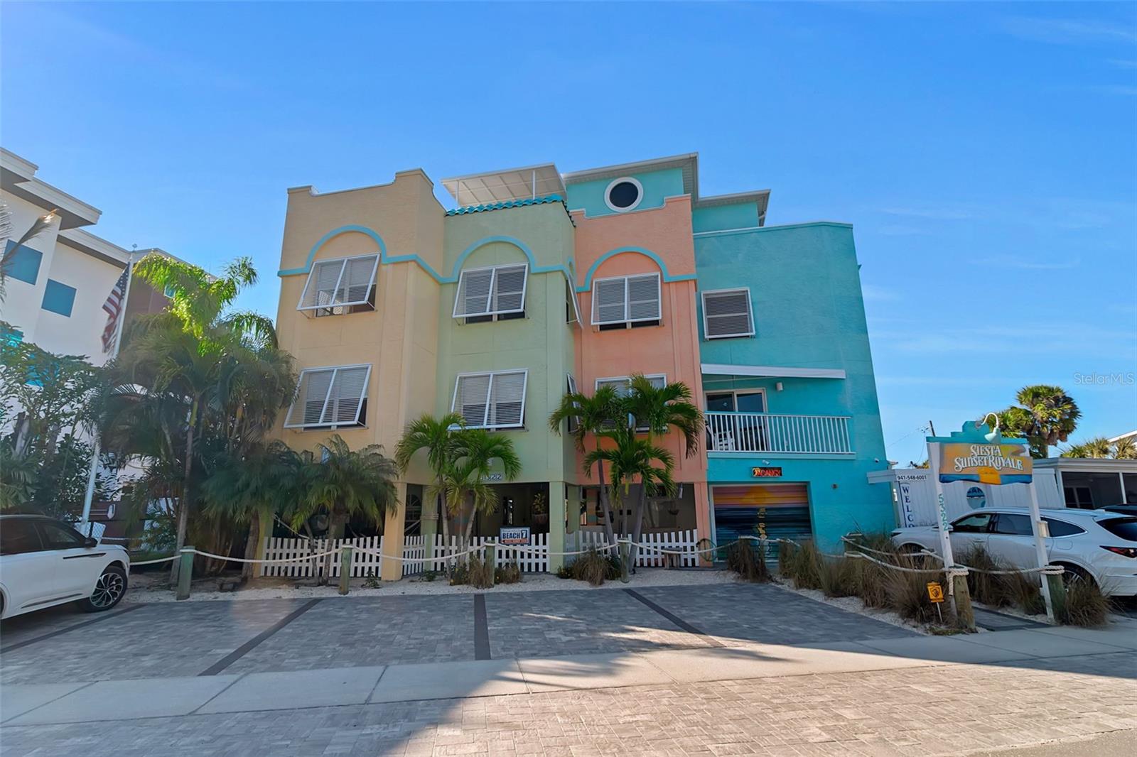 5.9% Seller Financing and Nightly rentals, a unicorn. This 7-unit investment property is unique in that it operates more similar to hotel than a single family vacation rental. It has years of returning guests and it's one of very few elevated properties allowing the former mentioned, nightly rentals. 2-studios, 2-1 bedrooms, 2-2 bedrooms, and a penthouse suite with wrap around balcony. Your guests will enjoy a great pool area, sizable covered space with a grill, on site laundry, and a roof top deck. It's 1 block to both the Village and beach, guests walk everywhere. Park your car in one of the 7 newly pavered spaces and don't start it again until the vacation is over. Now for you the owner, a private office/guest check in, 2 storage areas for linens housewares etc, and a commercial laundry for turnovers. These types never trade, don't let another 20 years pass before this sells again.
