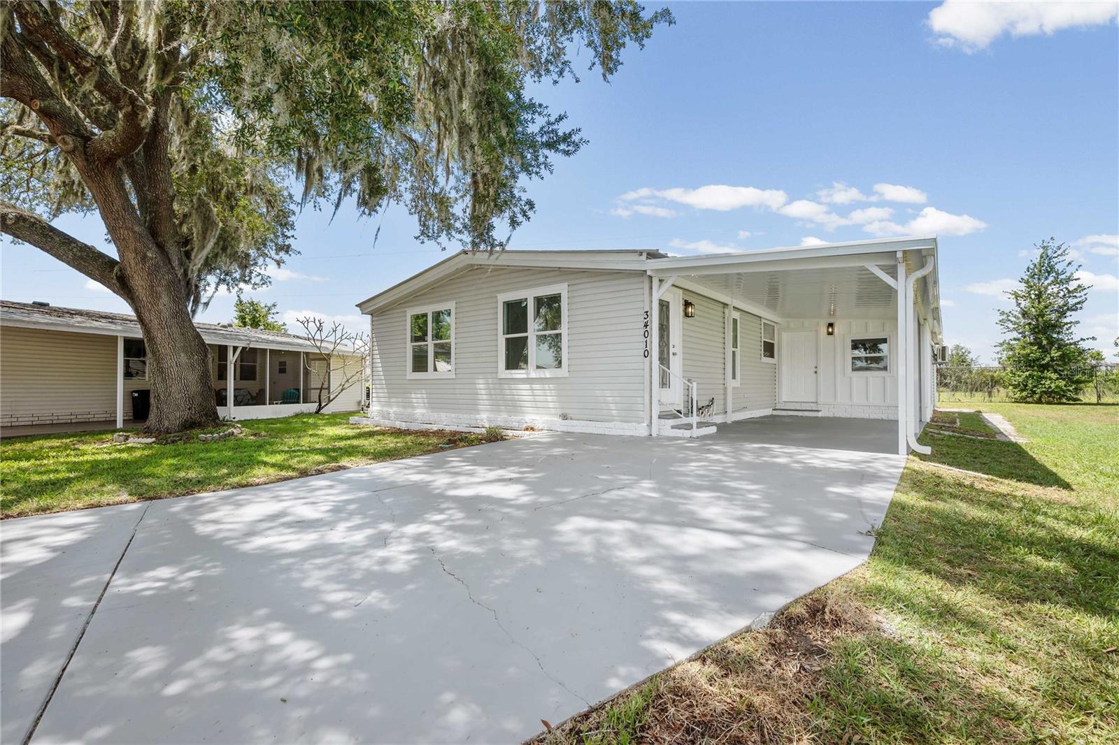 Get a fresh start with this beautifully renovated home in the highly sought-after gated community of Timber Lake Estates! This move-in-ready 3-bedroom, 2-bath residence has been thoughtfully updated from top to bottom, offering modern style, comfort, and peace of mind.
Step inside to discover a stunning new kitchen featuring soft-close cabinetry, sparkling white quartz countertops, an under-mount sink, and contemporary finishes that make both cooking and entertaining a pleasure. The freshly painted interior is complemented by new luxury vinyl plank flooring throughout, creating a seamless and durable living space.

Additional upgrades include new interior doors and hardware, updated trim and crown molding, modern ceiling fans and lighting fixtures, and partially updated plumbing. The versatile bonus room, which can serve as a third bedroom, home office, or flex space, features a new sliding glass door and its own mini-split system for year-round comfort.
Outside, you'll appreciate the newly constructed carport, freshly painted driveway, and the privacy and security that come with living in this gated community.
Conveniently located near shopping, dining, schools, and major highways, this home offers the perfect opportunity to start fresh without the worry of major updates. Simply move in and enjoy all the improvements already completed for you.

Don't miss your chance to own this beautifully refreshed home in Timber Lake Estates—schedule your private showing today!