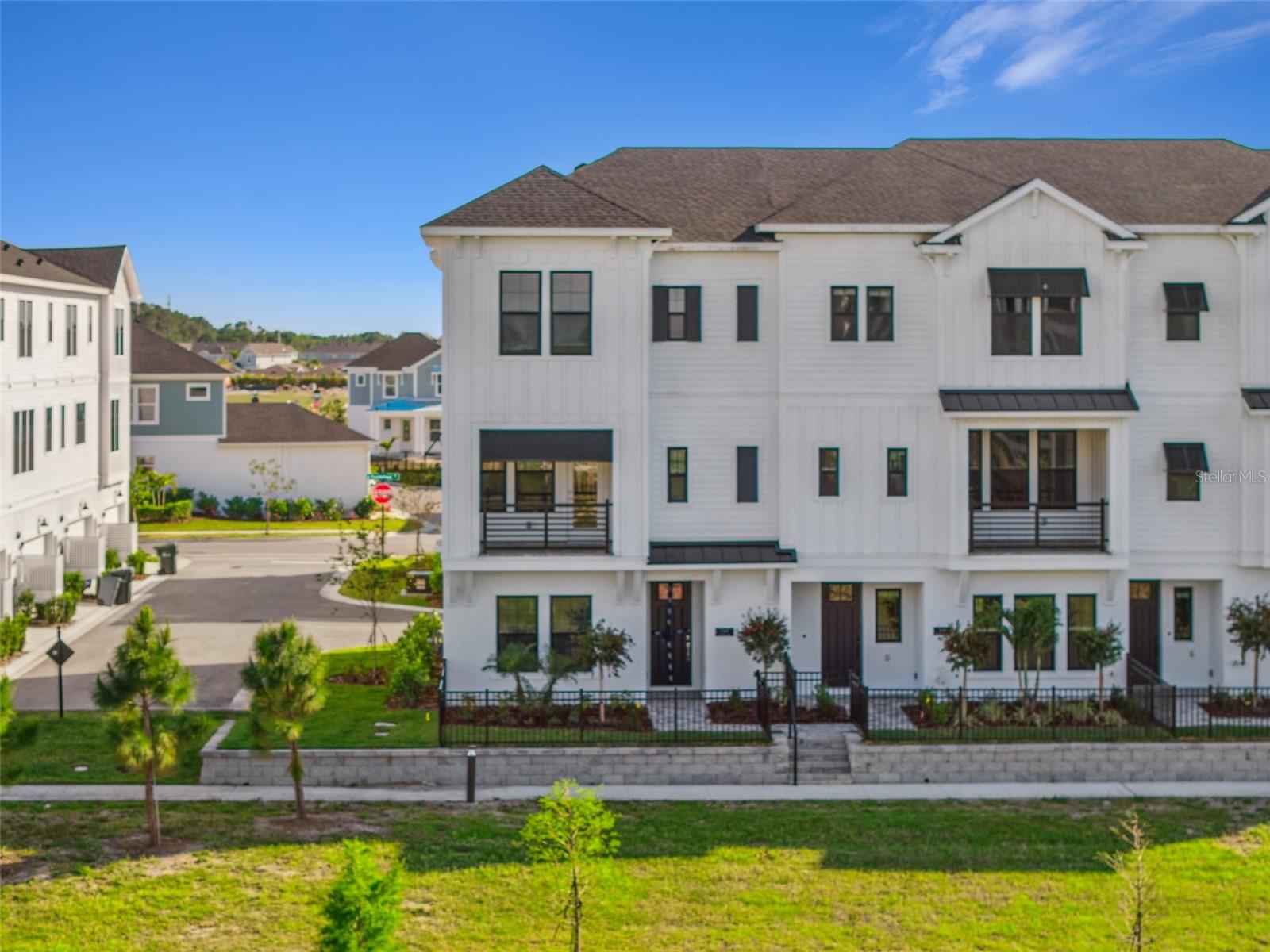 This thoughtfully designed townhome is now available for annual rent at $4,300/month. With a desirable northeast-facing orientation, the home is filled with natural light, especially in the mornings—perfect for enjoying sunrises from your second-floor balcony. Inside, you'll find a spacious layout with ensuite bathrooms in each bedroom. The primary suite includes a beautifully upgraded bathroom with an oversized shower and rainfall showerhead for a spa-like experience. A private elevator adds a touch of luxury and convenience, and the hurricane-impact windows provide extra safety and energy efficiency. The large, attached 2-car garage includes extra storage under the stairs, helping you stay organized and eliminating the need for off-site storage. The rent includes exterior maintenance, landscaping, irrigation, access to community amenities and trash collection. Credit and background checks are required. First month, last month and security deposit due prior to move-in.