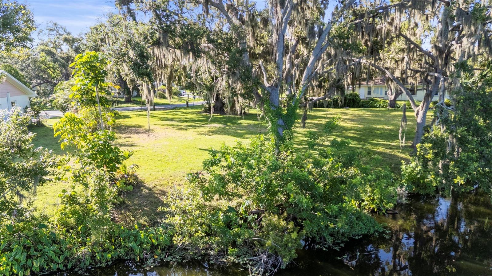 Price Reduction!!! Build Your Dream Home in Desoto Lakes
This rare 0.27-acre waterfront lot in the desirable Desoto Lakes community offers 170 feet of scenic shoreline on Desoto Lakes. With NO DEED RESTRICTIONS and access to public water and sewer, this property is a blank canvas for your custom-designed home.
Enjoy privacy, stunning water views, and the unique charm of this sought-after Florida neighborhood. Sarasota County’s improvements, including relocating power lines underground, will enhance both resilience and aesthetics.
Conveniently located near shopping, dining, UTC mall, Downtown Sarasota, and SRQ airport, with nearby parks offering outdoor recreation. Plus, the sellers have a permit to remove an existing Oak tree, readying the lot for your dream home. Don’t miss this rare opportunity to create your perfect lifestyle in Desoto Lakes!
