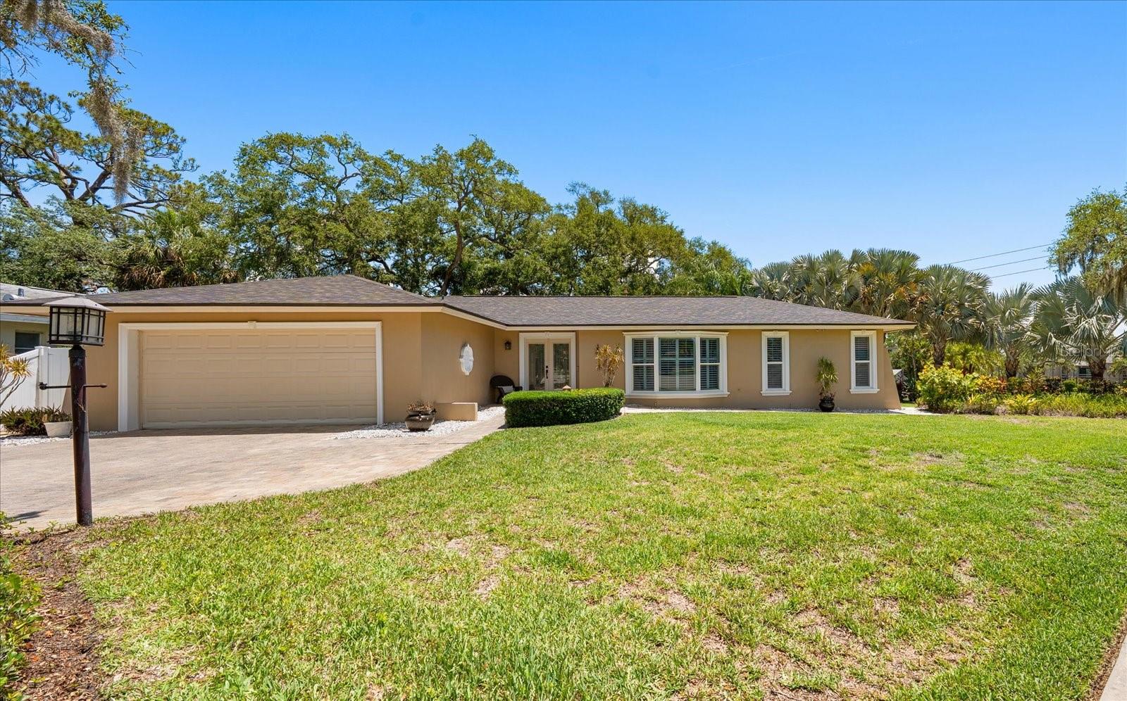 Welcome to this beautifully maintained 3-bedroom, 2-bath home in the desirable Del Oro Groves neighborhood, where comfort, charm, and an exceptional Florida lifestyle come together. Lovingly cared for by the same owner for the past 30 years, this home offers a spacious split floor plan with a living room, family room, dining room, and Florida room, providing plenty of space to relax and entertain. Inside, you’ll find wood floors throughout the main living areas, tile flooring in the kitchen, plantation shutters throughout, updated windows, a large pantry, and an updated kitchen and bathrooms. The home also has natural gas connected, adding convenience and efficiency. Major updates include a roof replaced in 2021 and HVAC replaced in 2020. Outside, the long and widened paver driveway provides plenty of parking and enhances the home’s curb appeal. Step out back to the large composite deck and enjoy peaceful views of Old Tampa Bay , the perfect setting for morning coffee, evening sunsets, or outdoor gatherings. The location is truly hard to beat. Just steps from your front door, you can access the Ream Wilson Trail, offering a scenic route to Safety Harbor or Tampa via the Courtney Campbell Causeway. Just across from Cooper’s Bayou Park, you can enjoy fishing, walking trails, an exercise course, and a kayak or canoe launch. Del Oro Park is also nearby with pickleball courts, a playground, and basketball courts. Take your golf cart to Downtown Safety Harbor and enjoy Main Street’s restaurants, boutique shops, breweries, museums, live music, and year-round events. The Safety Harbor Marina and Safety Harbor Resort and Spa are just minutes away. Best of all, the home is not located in a required flood insurance zone.