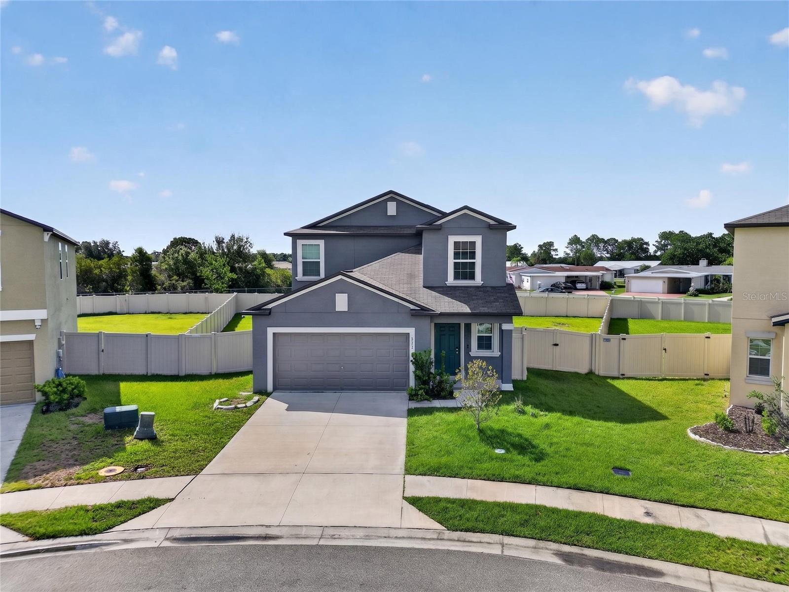 Situated on a premium lot in the Saddle Creek community, this beautiful 2022 built home offers the perfect blend of space, style, and functionality. Featuring 5 bedrooms, 2.5 bathrooms, over 2500 sqft, and a well designed floor plan, there's plenty of room for everyday living, entertaining, and everything in between. The first floor features a spacious primary suite along with a conveniently located laundry room, while the second level offers four additional bedrooms, a versatile loft/flex space, and wide hallways that contribute to the home's bright and open feel. The kitchen serves as the centerpiece of the home, seamlessly opening to the living and dining areas. Complete with granite countertops, stainless steel appliances, ample cabinetry, and generous counter space, it's designed for both everyday convenience and entertaining guests. Out back, you'll find a fully fenced yard and an impressive 20' x 16' screened patio, providing the perfect space to relax, dine outdoors, or host family and friends throughout the year. Adding even more value, the home is equipped with a solar energy system designed to help offset electricity costs and improve long term energy efficiency. Just a short stroll from the community pool and amenities, this move in ready home combines modern finishes, a functional layout, and an exceptional location. If you're looking for a home with space to grow in one of the area's most desirable neighborhoods, this one deserves a spot at the top of your list.