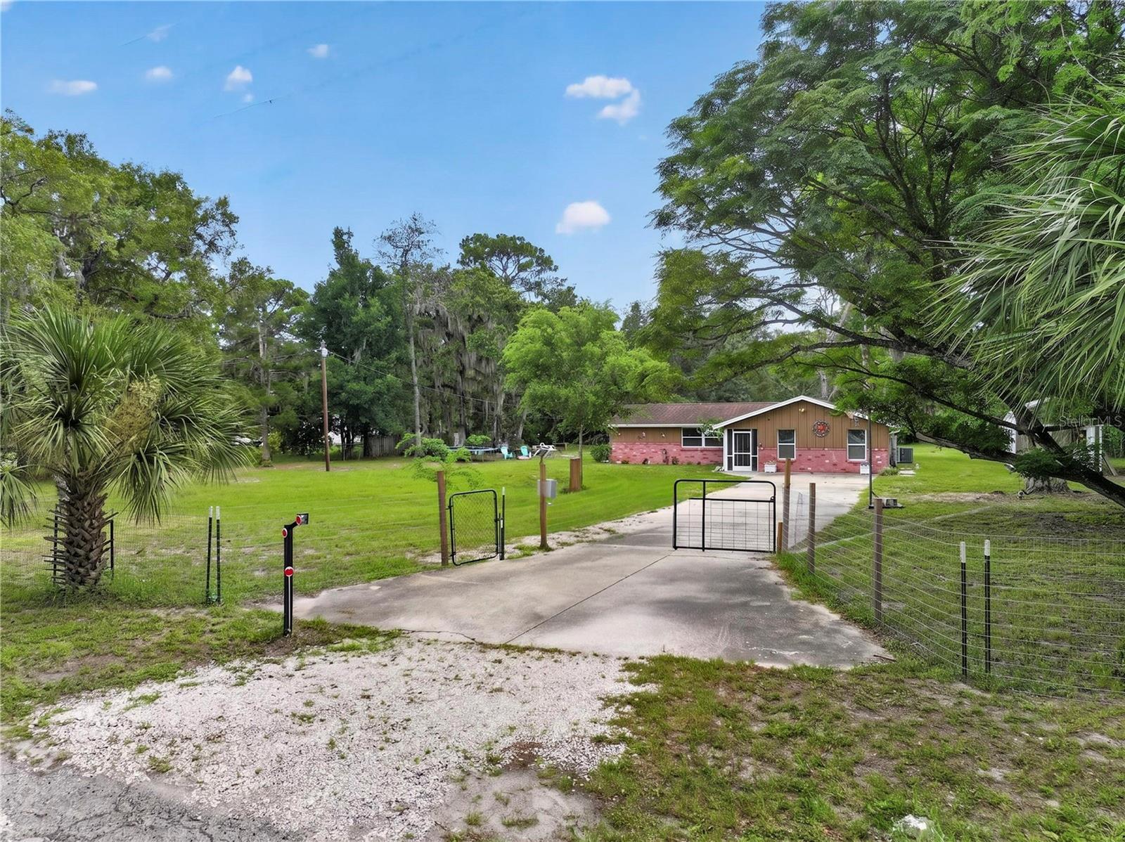 Welcome to your own private retreat in the desirable Hise Hills community of Hudson! Nestled on over a fully fenced acre, this spacious 4-bedroom, 3-bathroom home offers the perfect blend of peaceful country living and modern convenience. Inside, you’ll find generous living spaces designed for both everyday comfort and entertaining. Step outside to your backyard oasis featuring a sparkling pool, relaxing hot tub, and a large screened lanai—the perfect place to unwind while enjoying the tranquil surroundings. Bring your RV, boat, ATVs, and all your animals—there’s plenty of room for them here! The property currently includes a pig and chickens in their own coops, and they can even stay with the new owner if desired. An additional tiny home provides the perfect space for guests, multigenerational living, a home office, or potential rental income. Major updates offer peace of mind, including a new well (2024, 120 ft), gutters (2020), new windows (2019), tankless water heater (2019), pool and hot tub (2019), AC (2018), and roof (2012). Enjoy the privacy of country living without sacrificing convenience. Located just minutes from the Suncoast Parkway. You’ll have easy access to shopping, dining, entertainment, and everything the Tampa Bay area has to offer. If you’ve been searching for space, privacy, and endless possibilities, this exceptional property is ready to welcome you home.