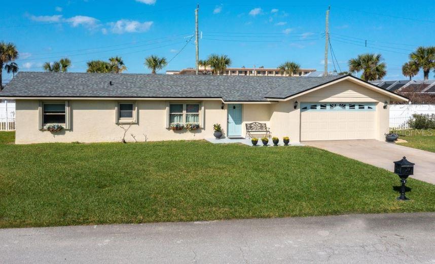 Absolutely stunning 3 bedroom/2 bath, 2 car garage, beach home here in beautiful Ormond by the Sea! You will be blown away by the detail and open living area as soon as you walk through the front door. This home has had many upgrades and improvements over the last several years. Some of which include a 2022 Roof, Hurricane Windows and Sliders throughout with accordion storm shutters over the windows for added piece of mind. No carpet in this house; you will see Luxury Vinyl floors in the main living areas and bedrooms, then in the bathrooms you have tile on the floors and gorgeous custom tile work in the showers. In the kitchen you have high-end stainless-steel appliances, including an induction Range, Granite countertops, Custom cabinetry with slow-close doors. ;Water: City