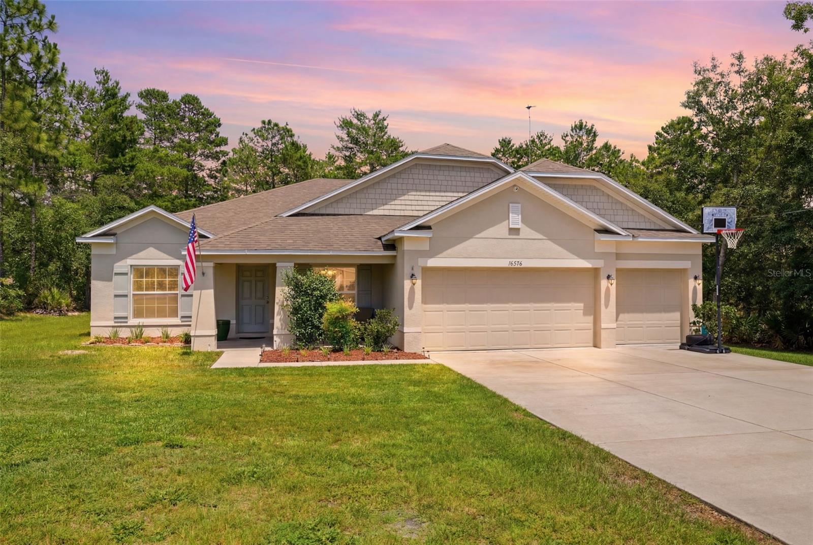Gorgeous pool home located in the popular Weeki Wachee/Brooksville area! This 4 bedroom, 3 bath, OVERSIZED 3 car garage is a must see! EASY 5 bedroom! So much to offer, starting with ONE ACRE lot MOL, great curb appeal and a massive driveway for ample parking. PAVED ROAD! Many upgrades in this ONE OWNER property. The open floorplan offers 2438 heated sq ft. Total living space is well over 3300 sq ft. Great room and kitchen flow nicely together with a separate breakfast nook and formal dining area. The kitchen comes with beautiful espresso 42" soft close cabinetry, huge granite island, stainless steel appliances, pantry closet and tons of granite counter space. All bedrooms are split and spacious with a stunning primary suite. Bedroom 4 is perfect for MOTHER-IN-LAW or guests as it is separate with its own bathroom. In addition, there is a bonus/flex room to make a 5th bedroom or office. Inside laundry room! Separate office space with storage closet! More upgrades include a 16-camera HOME SECURITY SYSTEM with infrared 30-day recording hard drive, crown molding throughout, plank ceramic tile in all wet areas, 4-zone Hunter sprinkler system, Chamberlin garage door opener with two remotes and battery backup. Main area of home leads out to the gorgeous, screened lanai (under truss) with pool, making it perfect for large gatherings. The pool is a Latham fiberglass with tanning shelf and LED multicolor/function system. Screened pool cage is 20' x 40'. Pool dimensions are 12'x 28'6". Entertaining will be a dream in this home! You can swim and relax in privacy as the sides and rear yard are park like with no connecting neighbors. NO flood insurance required! NO HOA! Just minutes from Suncoast Parkway and some of Florida's most popular parks. Call for your private viewing today!