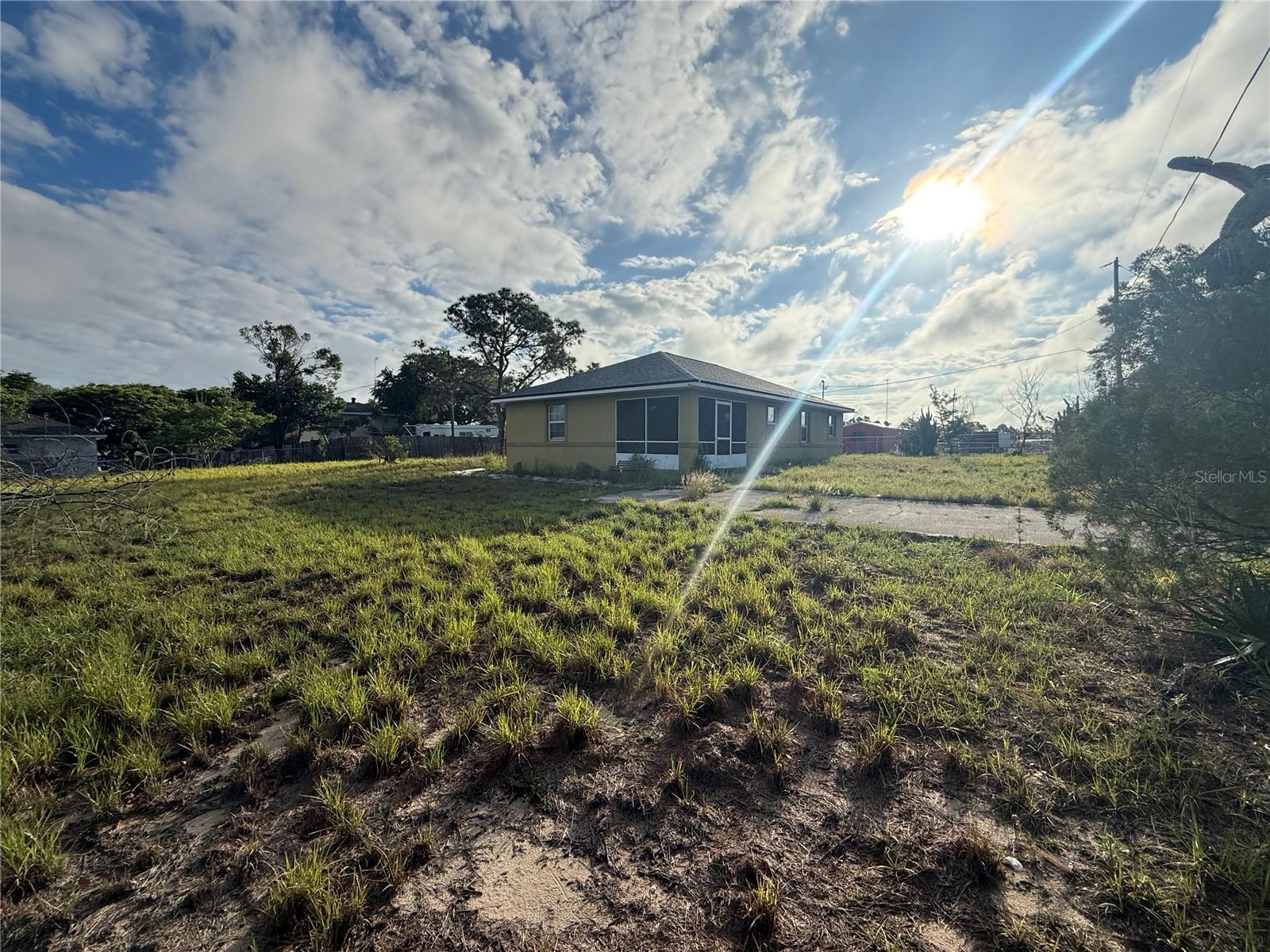 Bring your boat and toys to this cozy and quiet 3-bedroom, 2-bathroom home situated on nearly half an acre with NO HOA restrictions. 
Brand NEW roof. Fresh interior paint gives the home a clean updated feel. tankless water heater, complete AC service done in May..
The open living room and kitchen combo creates an easy flow, perfect for everyday living and entertaining. Enjoy added privacy with a fenced yard and plenty of outdoor space to make your own. This home is just a short drive from shopping, dining, schools, local parks, and popular attractions such as Bok Tower Gardens. Enjoy easy access to major roadways, making travel throughout Central Florida simple and convenient.