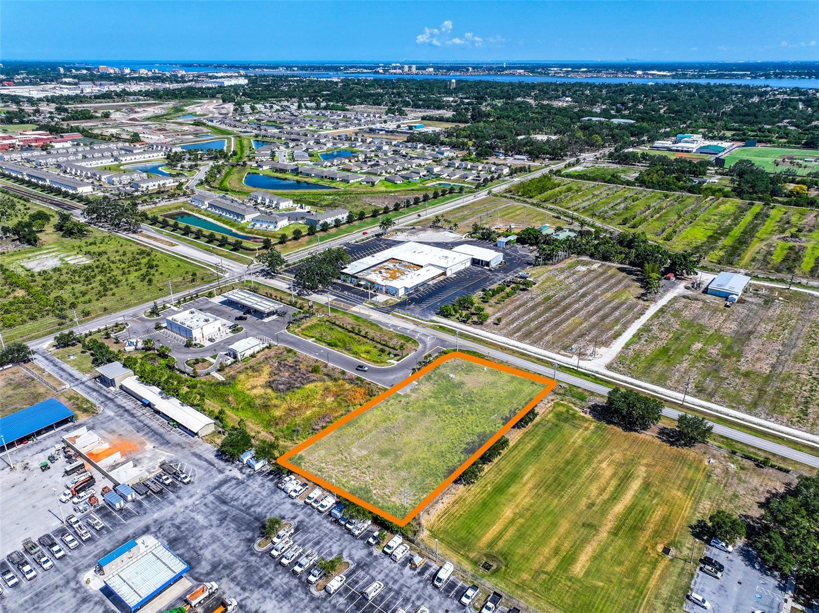 This 1+/- acre pad-ready commercial development site is strategically located along 26th Avenue East in Bradenton, Florida, offering an exceptional opportunity for a variety of high-demand commercial uses.

The site is positioned for development with utilities stubbed to the parcel, off-site master stormwater, and shared access with the adjacent 7-Eleven. The property benefits from direct access from 26th Avenue East, including a dedicated right-turn lane, as well as secondary access through the 7-Eleven site onto 27th Street East, providing enhanced ingress and egress for future users.

The property is zoned Manatee County Heavy Commercial (HC), allowing for a wide range of potential uses including drive-thru restaurants, retail, financial services, office and medical office, daycare, automotive services, equipment sales, warehouse, and other commercial applications. (Prohibited uses include: gas stations, convenience stores, and car washes.)

Positioned within a growing commercial and residential trade area, the site offers excellent connectivity with convenient access to major regional corridors including US-301, State Road 64, State Road 70, and 44th Avenue East. 

The surrounding area is supported by a strong employment base, including major regional employers such as Tropicana Brands Group, Bealls, Pierce Manufacturing, Team Edition Apparel, Pirate City, and LECOM Park, which continue to drive demand and investment in Central Bradenton.

Recent residential growth further strengthens the site's long-term commercial potential. Most notably is Glen Creek, the master planned community with 266 single family homes and 88 multi-family homes coming soon.  The nearby Evergreen and Evergreen Estates communities have delivered more than 400 new single-family homes since 2020, introducing hundreds of new households into the immediate trade area. Additional future growth is supported by Hundred Acre Wood, a nearly 100-acre planned residential community approved for more than 500 residential units, including single-family homes, townhomes, and higher-density residential options.

As development continues to expand east of US-301, available commercial land has become increasingly limited. This site is uniquely positioned to serve the growing population, workforce, and surrounding businesses, making it an ideal location for a neighborhood-serving commercial user seeking visibility, accessibility, and long-term growth potential.