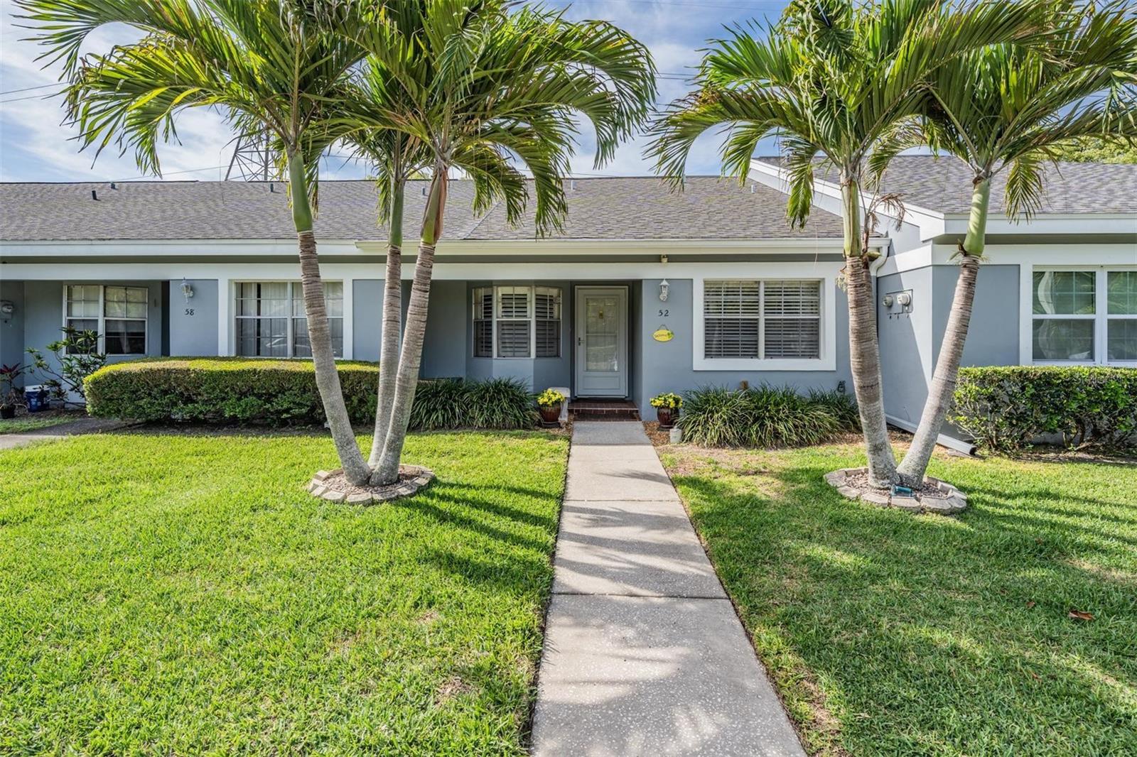 NEW PRICE!  Experience the wonderful, low-maintenance Florida lifestyle in this highly sought-after 2-bedroom villa, nestled in the desirable Bay Towne West community. Tucked away on a quiet dead-end street, this light-filled retreat offers the durability and peace of mind of solid block construction in a non-flood zone. Imagine starting your day with a cup of coffee on your private patio, overlooking a tranquil community pond and fountain, or unwinding as you enjoy Florida’s beautiful sunsets over the water.  Bay Towne West is located less than one mile from the heart of Safety Harbor, consistently celebrated as "Tampa Bay's best kept secret". Embrace the relaxed, small-town atmosphere and deep history of this waterfront community, which is famed for its tree-lined, brick-paved Main Street.  You are also near Philippe Park, which offers walking and biking trails, a boat ramp, fishing areas, and scenic waterfront views on Tampa Bay. Nearby Safety Harbor City Park spans 21 acres and is perfect for family recreation, featuring playground areas for all abilities, volleyball courts, baseball fields, and a skate park. Ideally positioned between Clearwater, Tampa, and St. Petersburg, this home is just 16 miles from Tampa International Airport and a quick 12-mile drive to the world-famous white sands of Clearwater Beach. Recent updates, including an AC replacement in 2022 to ensure that carefree living is truly yours. The exceptionally inexpensive $180 monthly HOA fee delivers exceptional value and convenience, covering the community pool and spa access, exterior painting, lawn care and irrigation, private streets, and cable TV.  Come make this home your own!